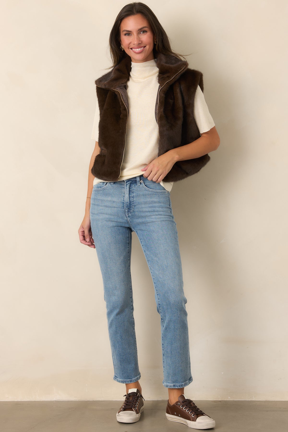 Chocolate brown plush vest with a substantial oversized collar, front zipper, and roomy front pockets.