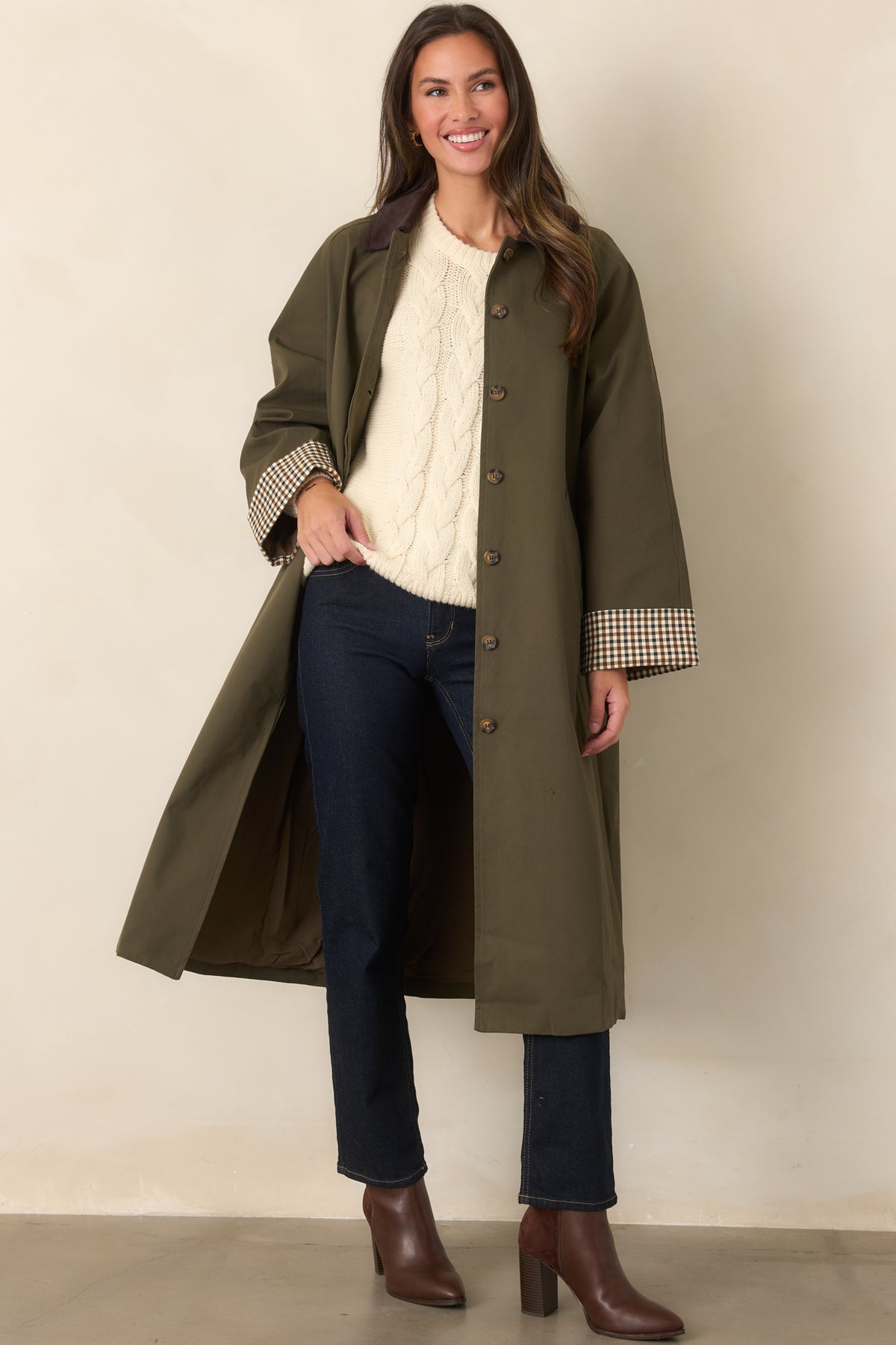 Chocolate brown corduroy collar accents this canvas-feel coat with checked cuffs and a defined waist.