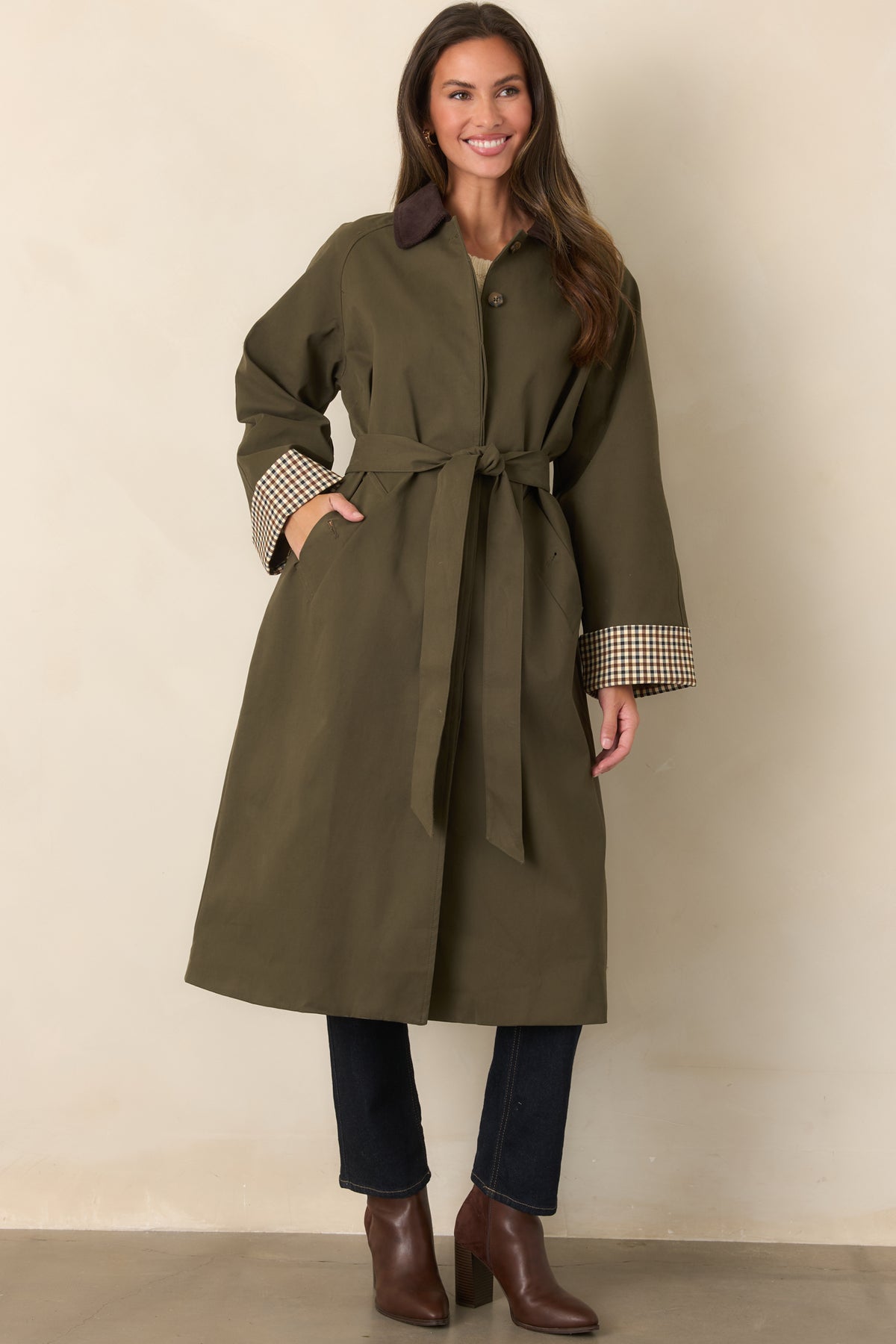 Coat with a chocolate brown corduroy collar, checked sleeve cuffs, tie belt, and smooth canvas-feel fabric.