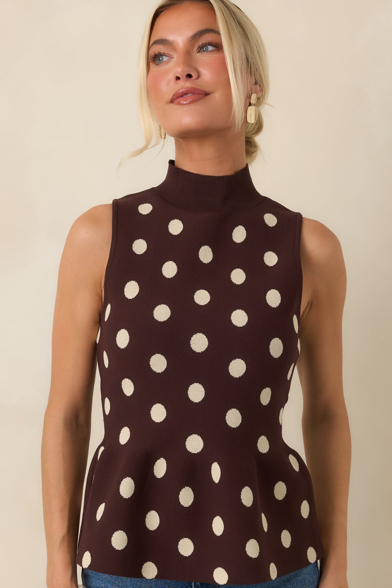 Detailed view highlighting the sweater knit texture and classic ivory polka dots against the chocolate brown fabric.