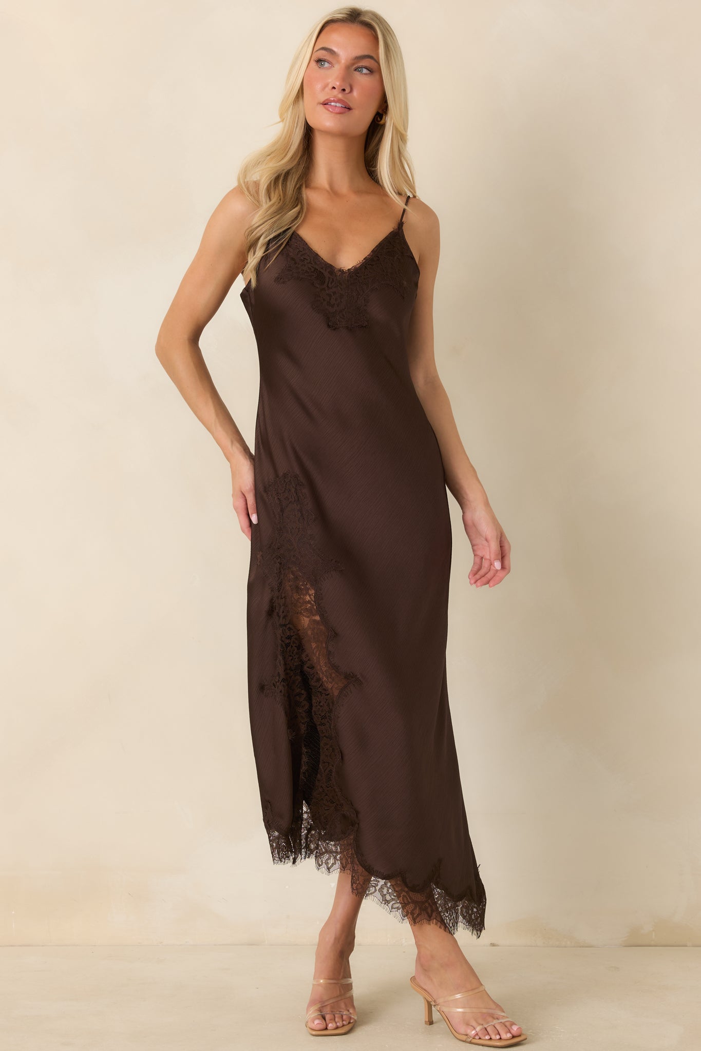 Romantic chocolate midi dress with a textured satin finish, eyelash lace accents, and a flowing asymmetrical hem.