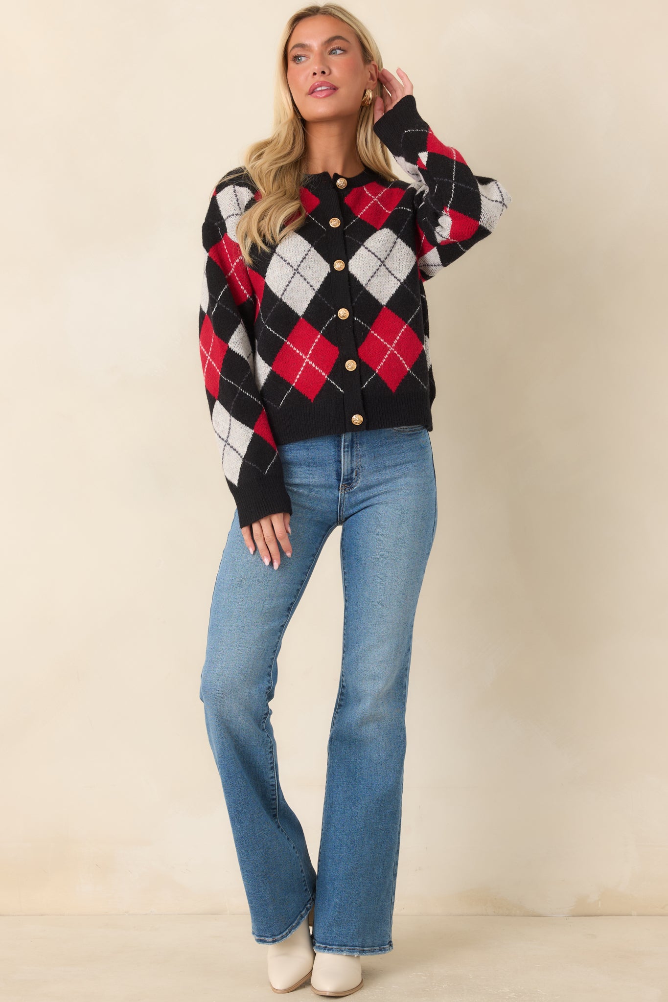 Classic argyle knit cardigan showcasing ornate gold-tone buttons and a comfortable relaxed fit.