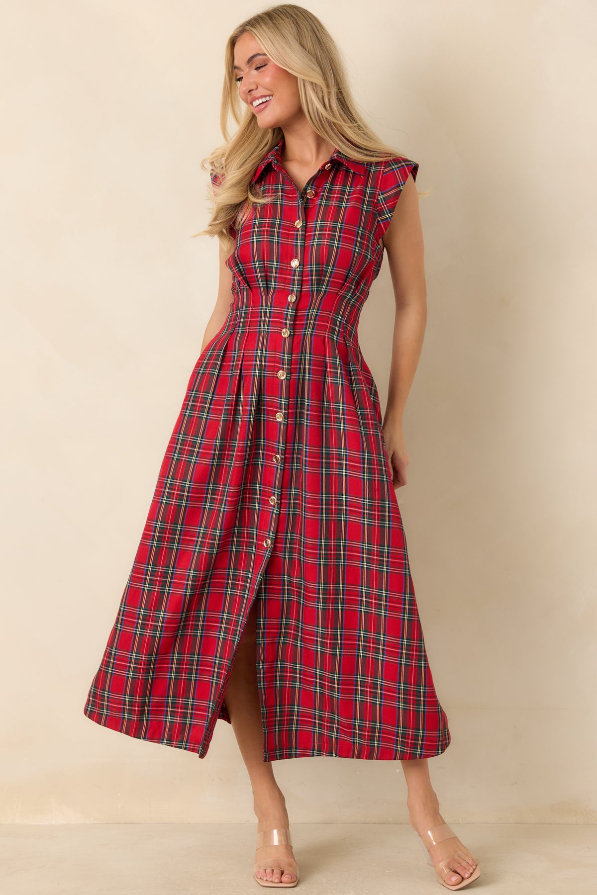 Classic button-front dress with a defined waist, lined construction, and a softly flared midi-length skirt.