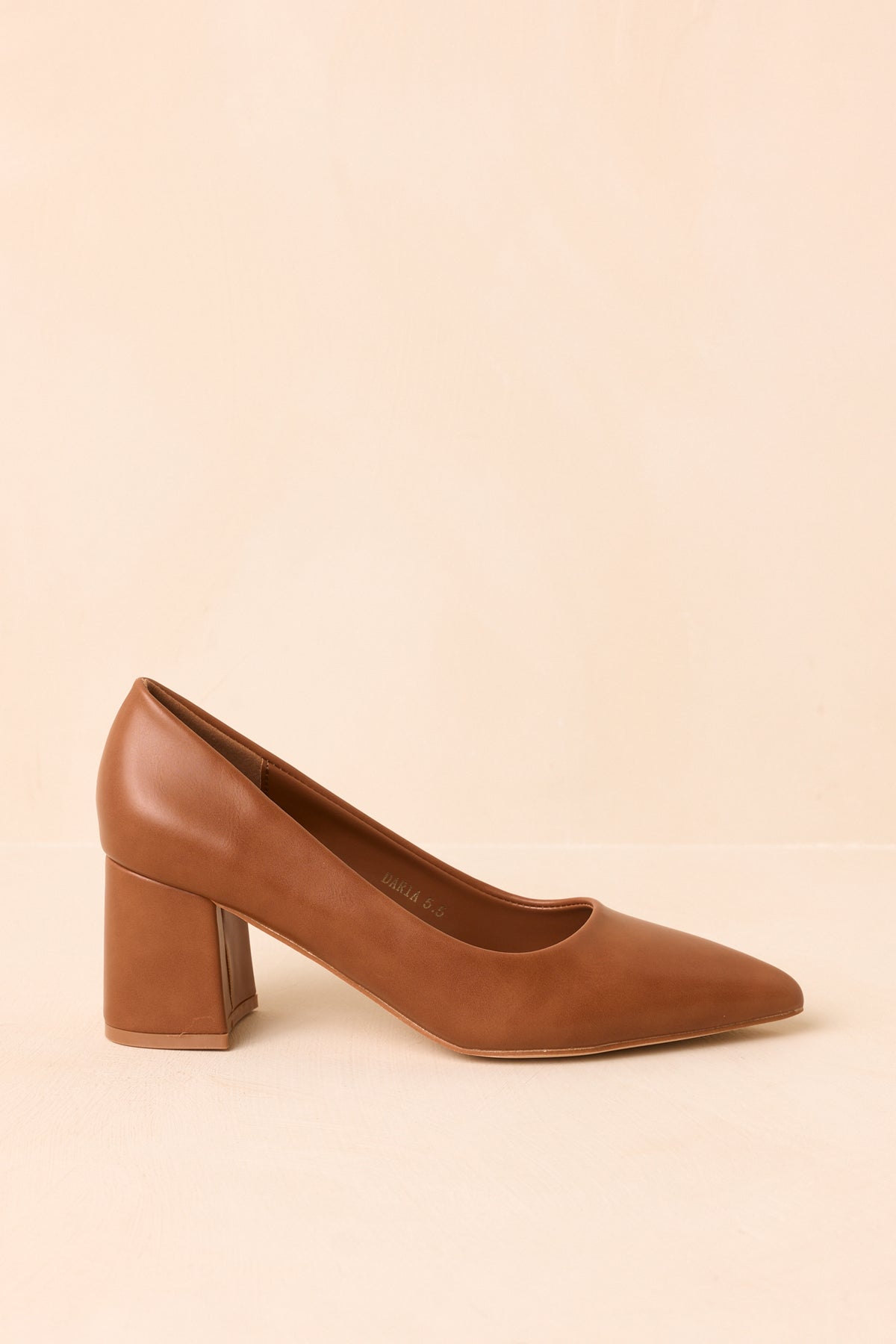 Classic heels highlighting the covered block heel and polished camel finish.
