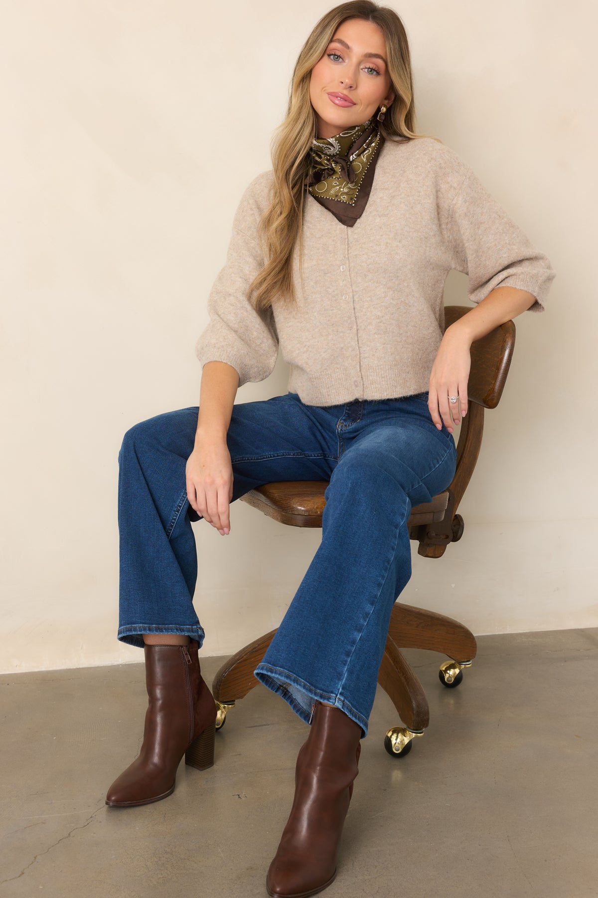 Cardigan featuring a classic crew neckline and functional button front.