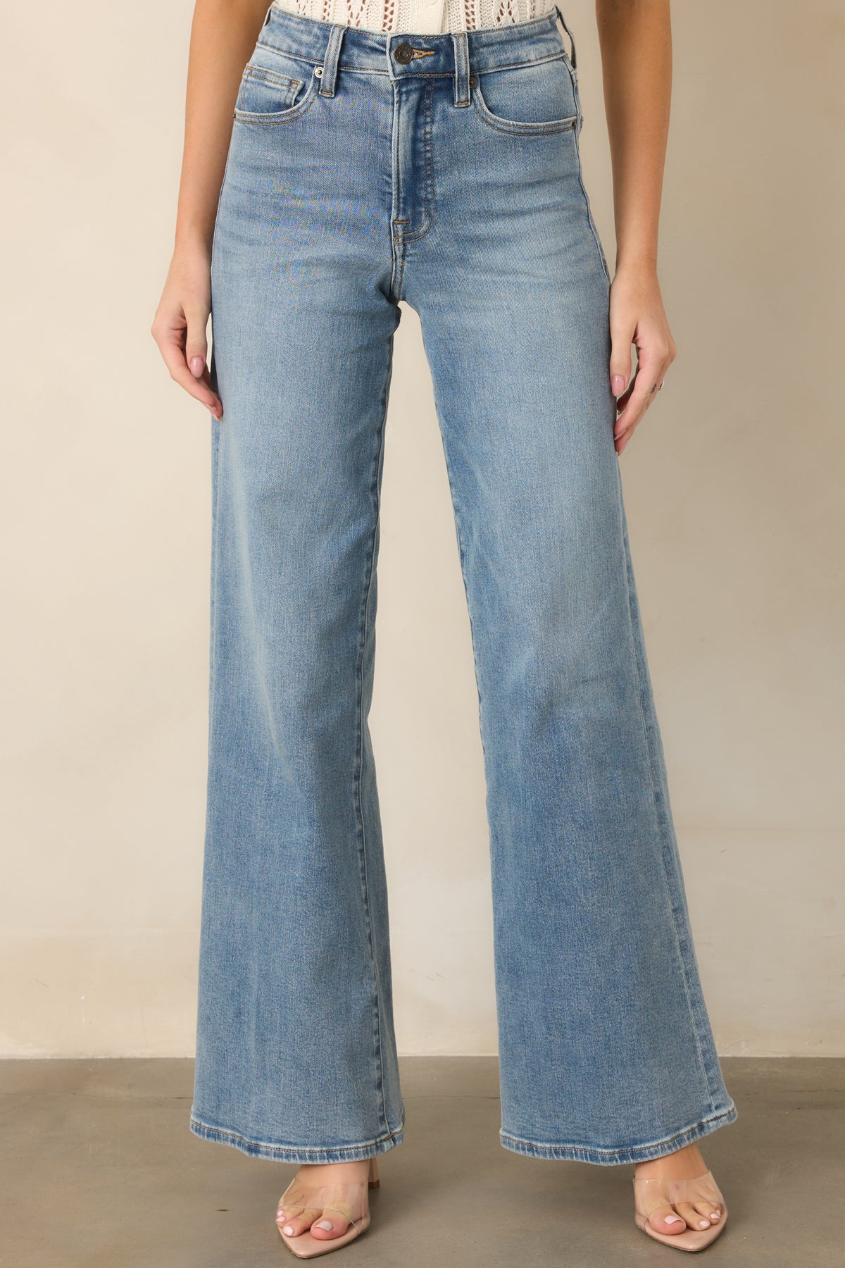 Classic light wash pants with a high-rise waist and long wide legs.