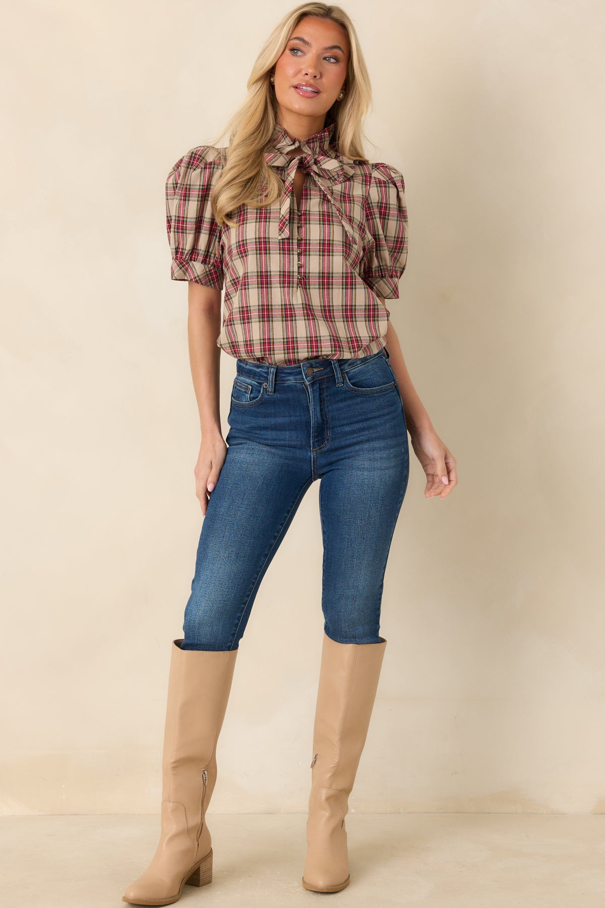 Classic plaid top featuring a matching neck tie, button-front opening, and fitted sleeve bands.