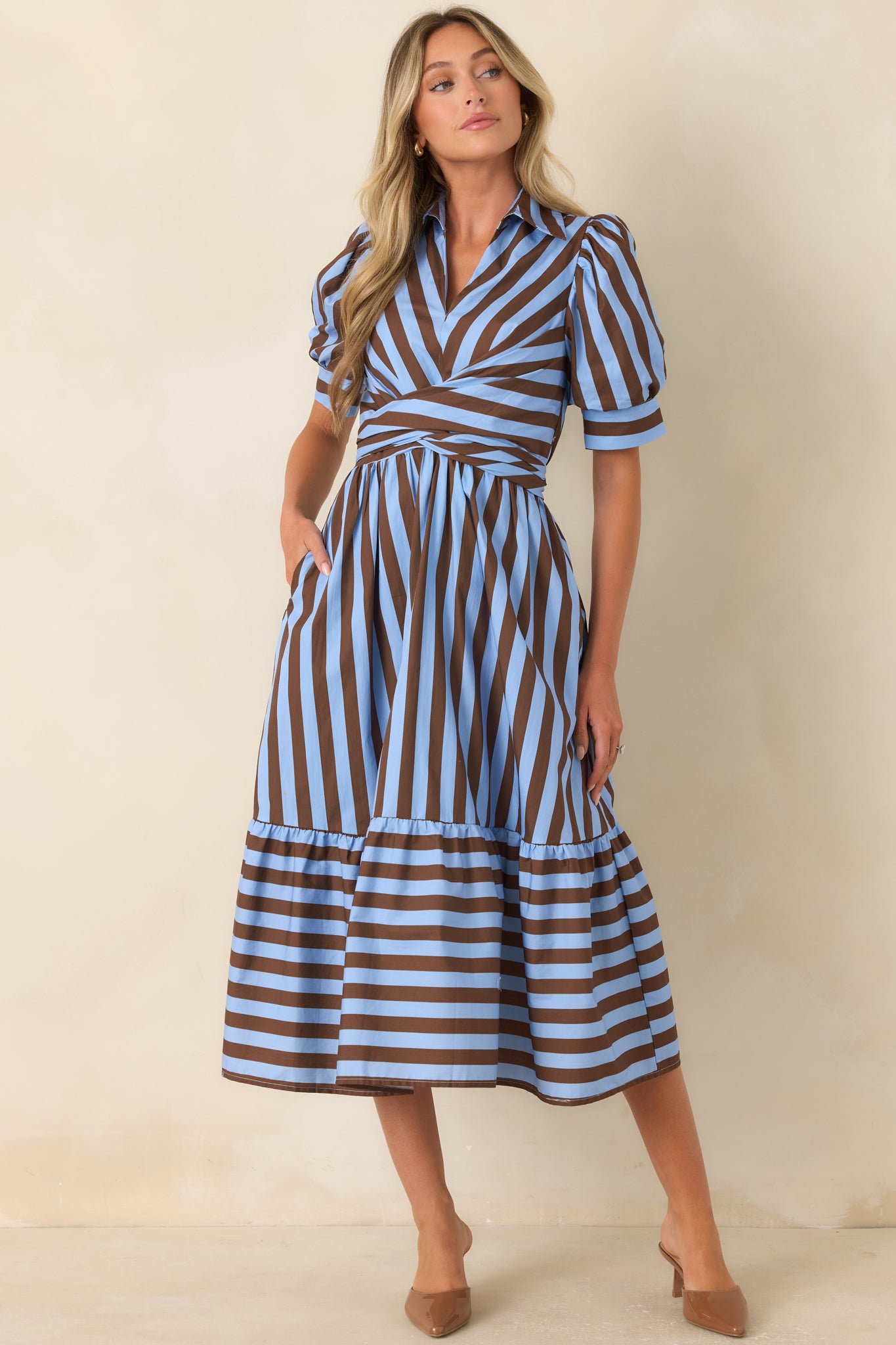 Classic striped midi dress featuring diagonal bodice stripes, a comfortable elastic back waistband, and a flowing gathered skirt with a bold horizontal-striped tier for a polished finish.