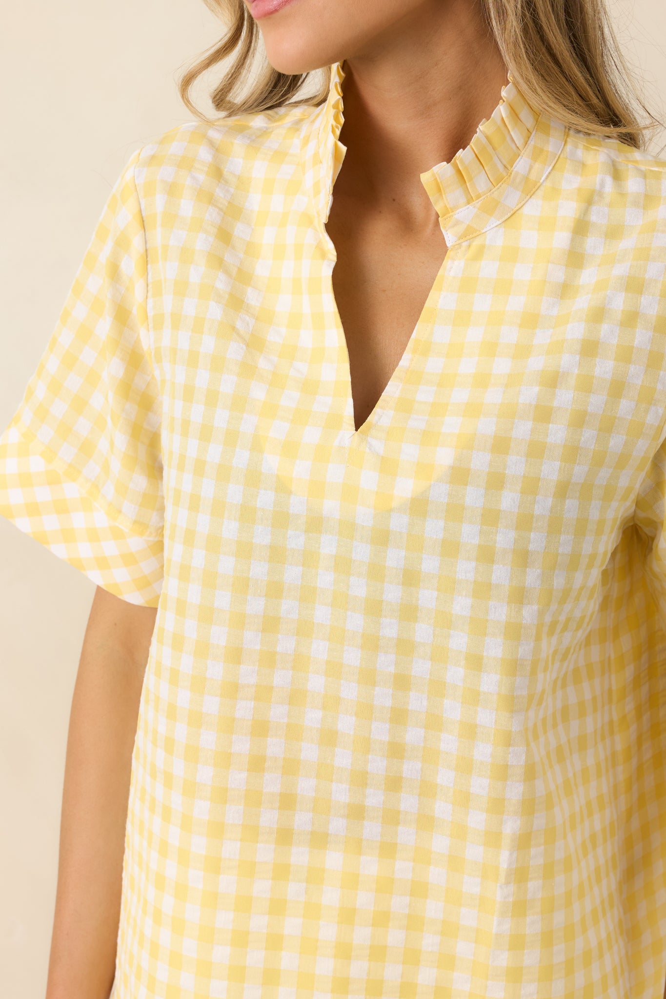 Classic yellow gingham check pattern on lightweight cotton fabric.