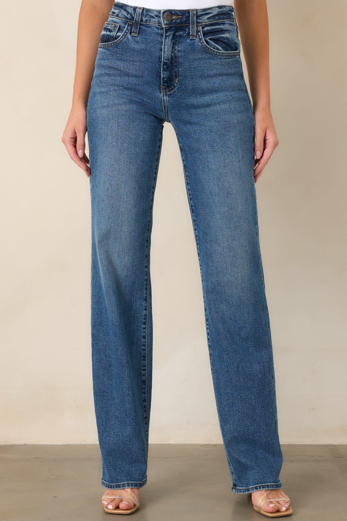 Front view emphasizing the clean straight-leg shape and polished structure of the elongated pants.