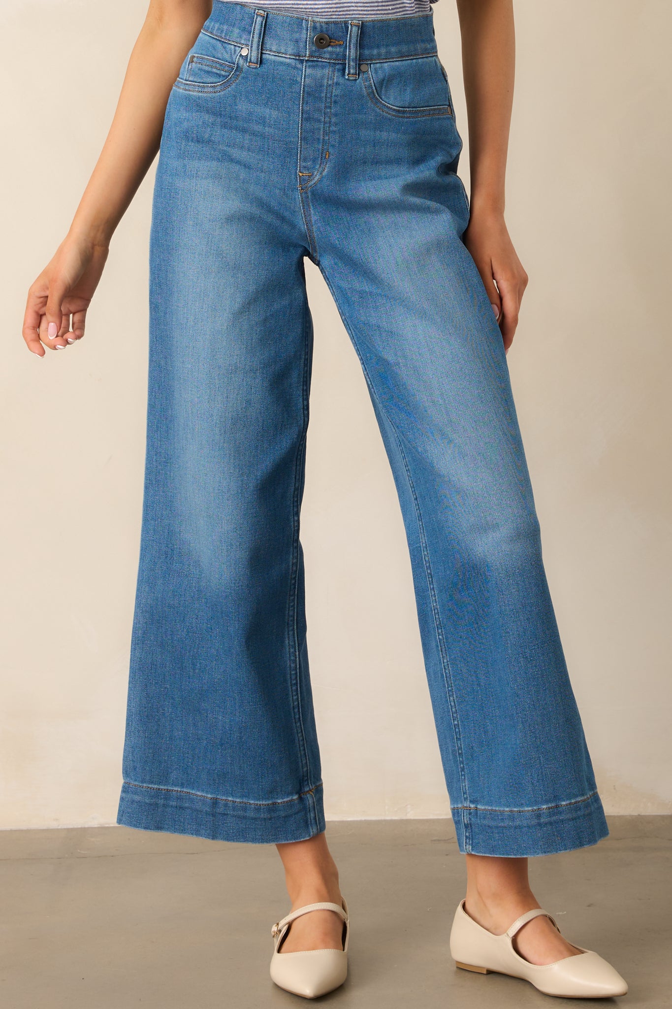 Close crop of the lower leg and hem, highlighting the streamlined cut and fabric flexibility.