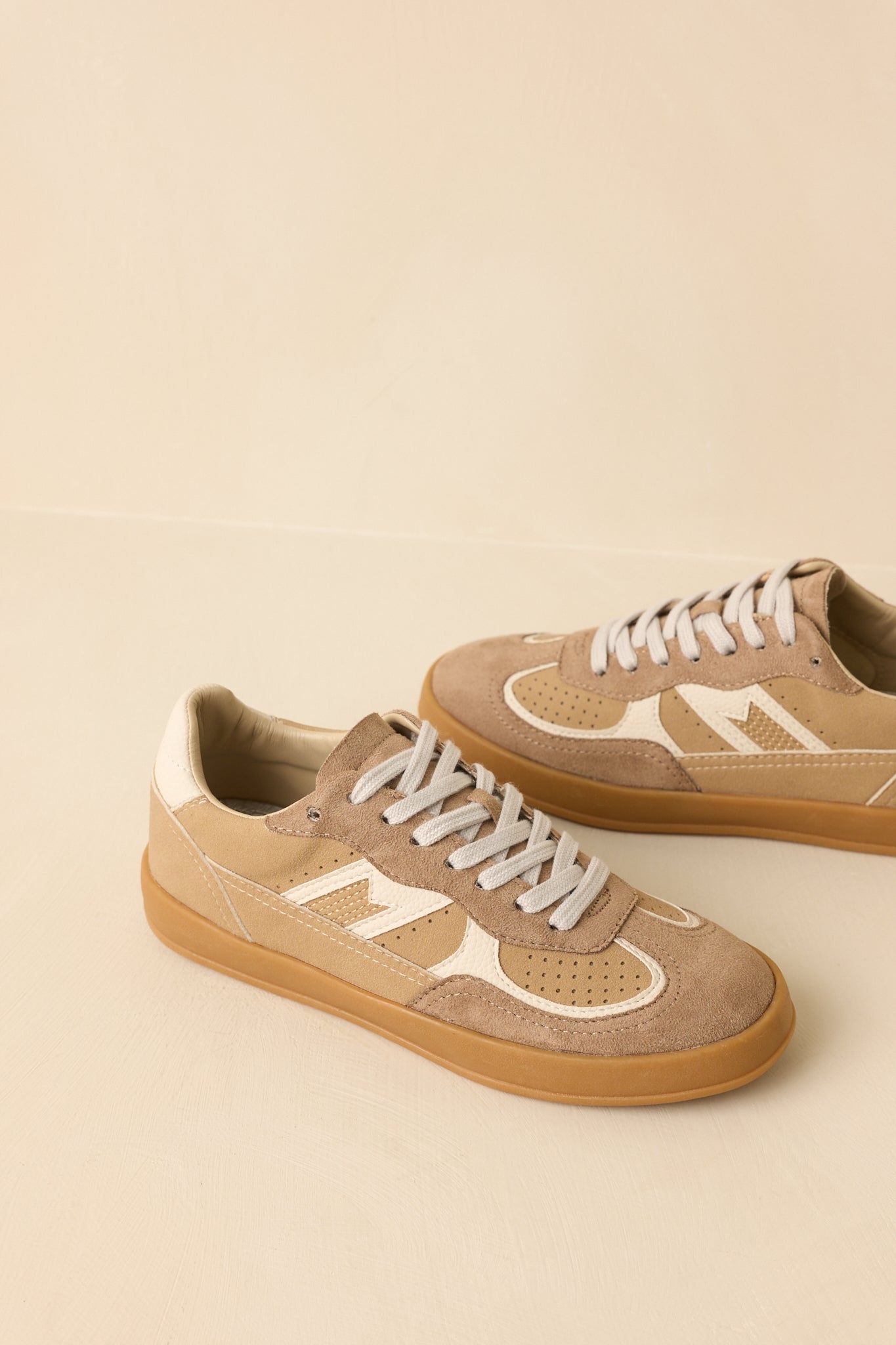 Close cropped angle highlighting the lace-up closure and structured paneling detail.