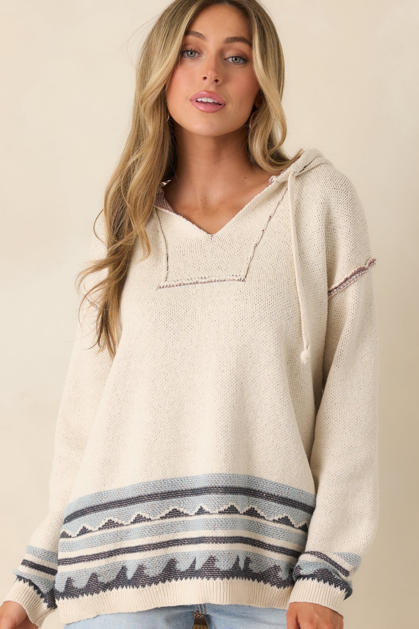 Close cropped detail of the ribbed cuffs and subtle wave stripe along the sleeves