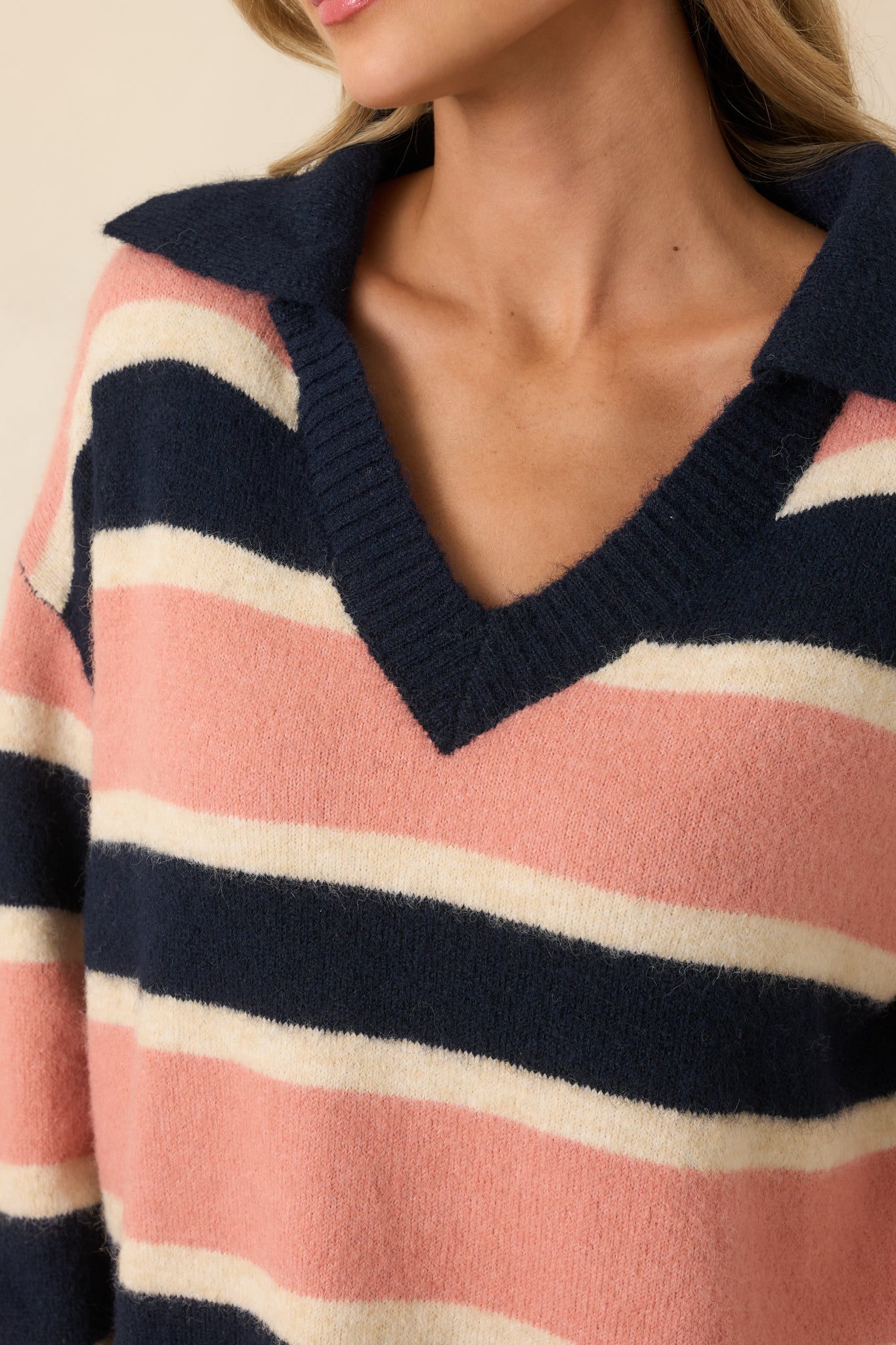 Close detail of the brushed knit fabric showcasing the navy, mauve, and cream stripe texture.