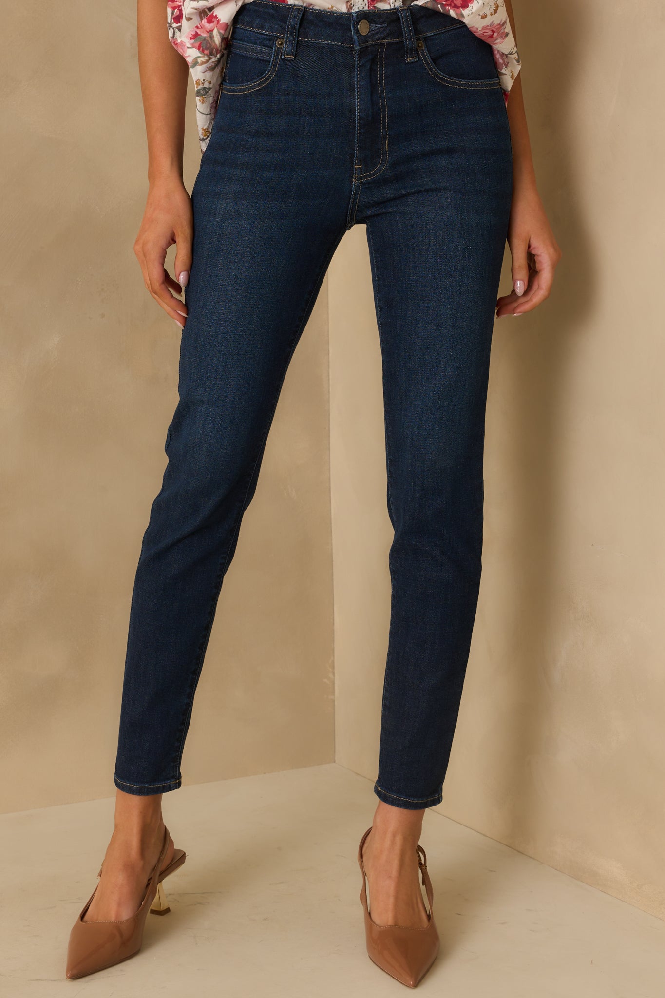 Close front section of the jeans showing functional pockets and contrast stitching.