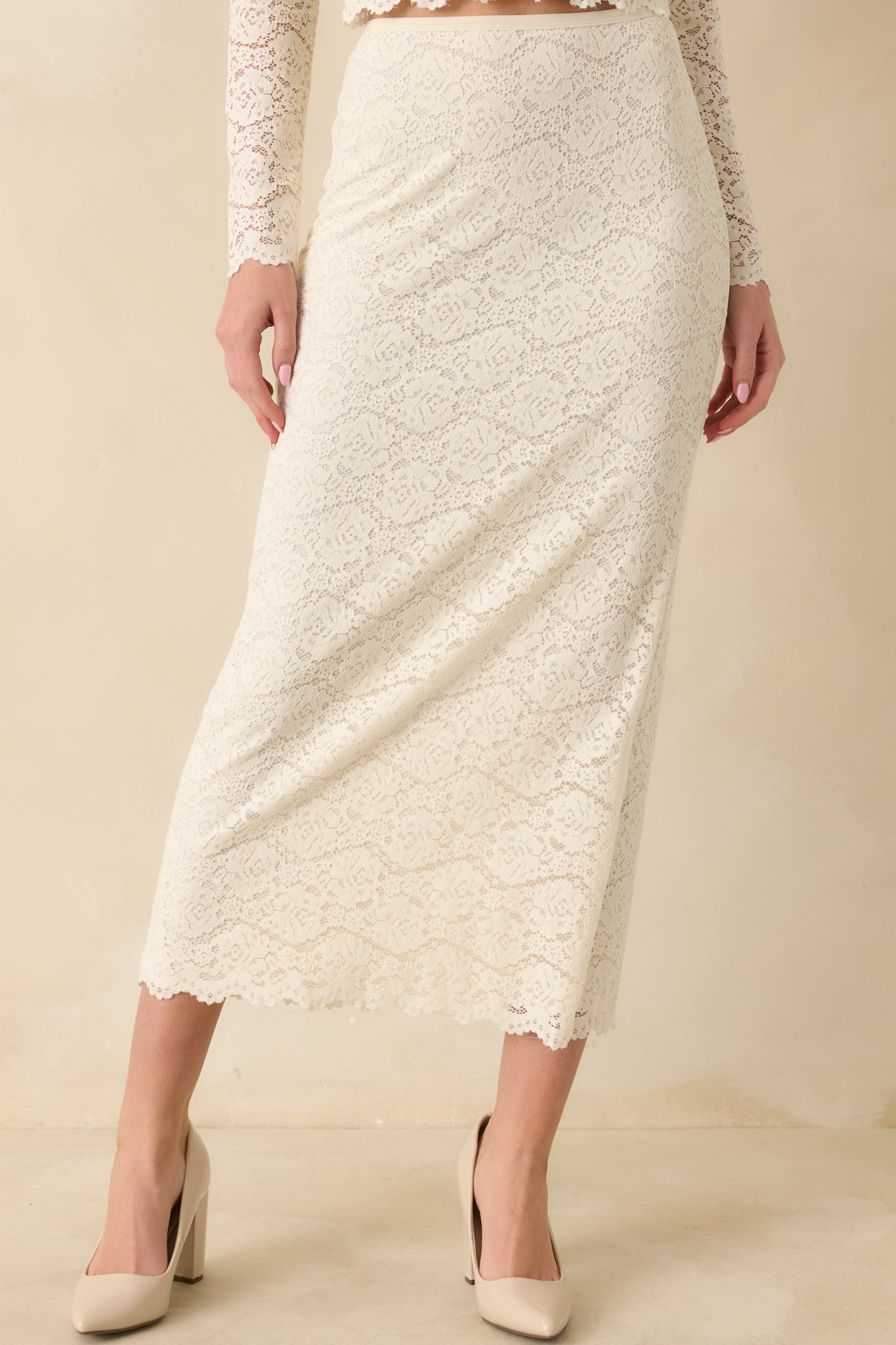 Close-up crop showing the intricate lace pattern and smooth knit lining beneath.