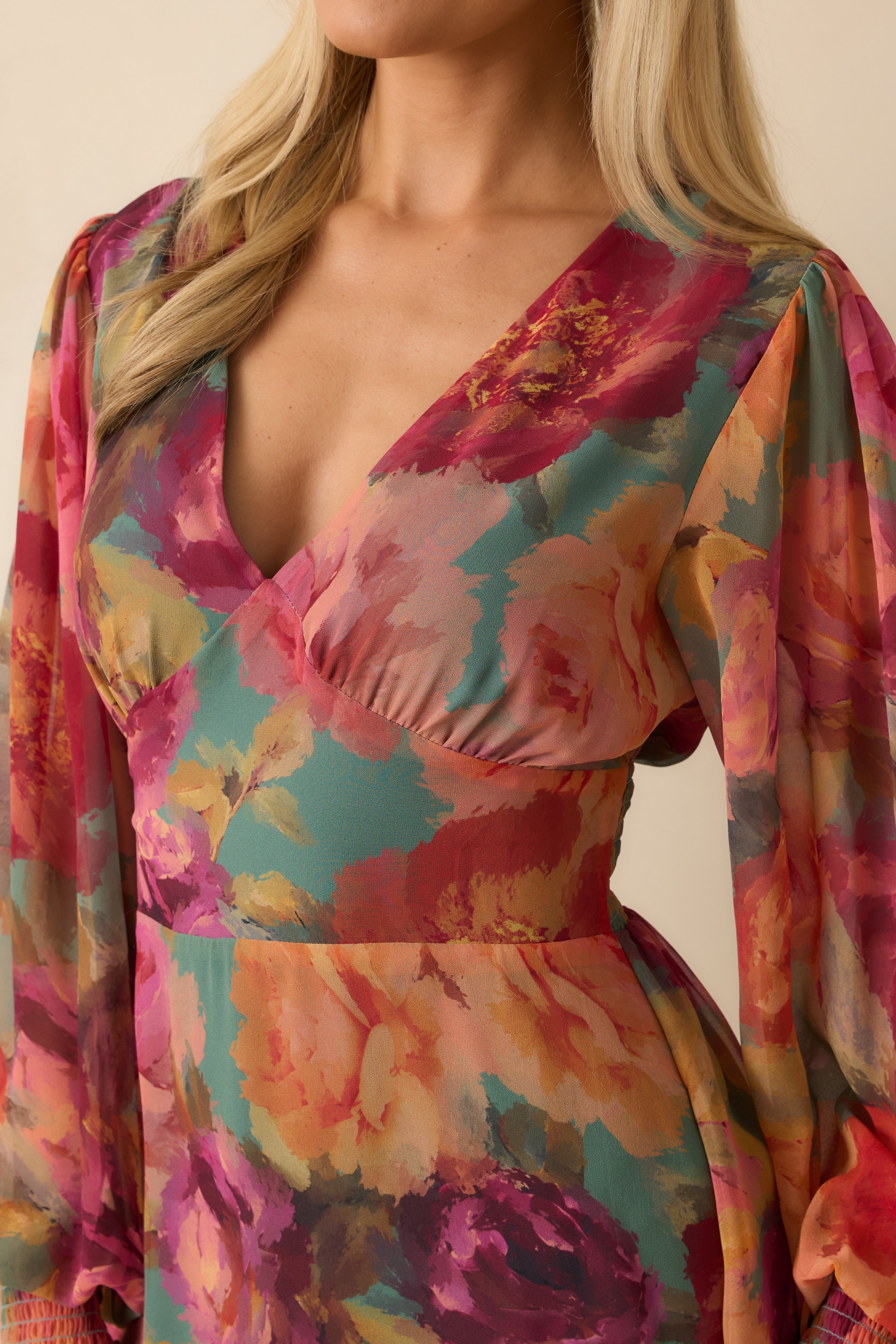 Close-up of the chiffon fabric showing the pink multi floral print and soft woven texture.