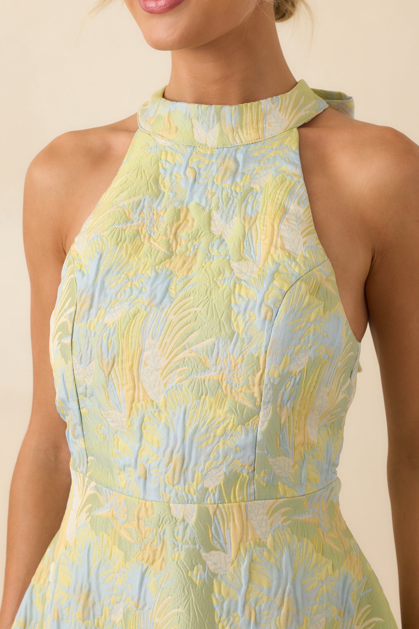 Close-up detail of the yellow and blue floral pattern woven into the jacquard fabric.