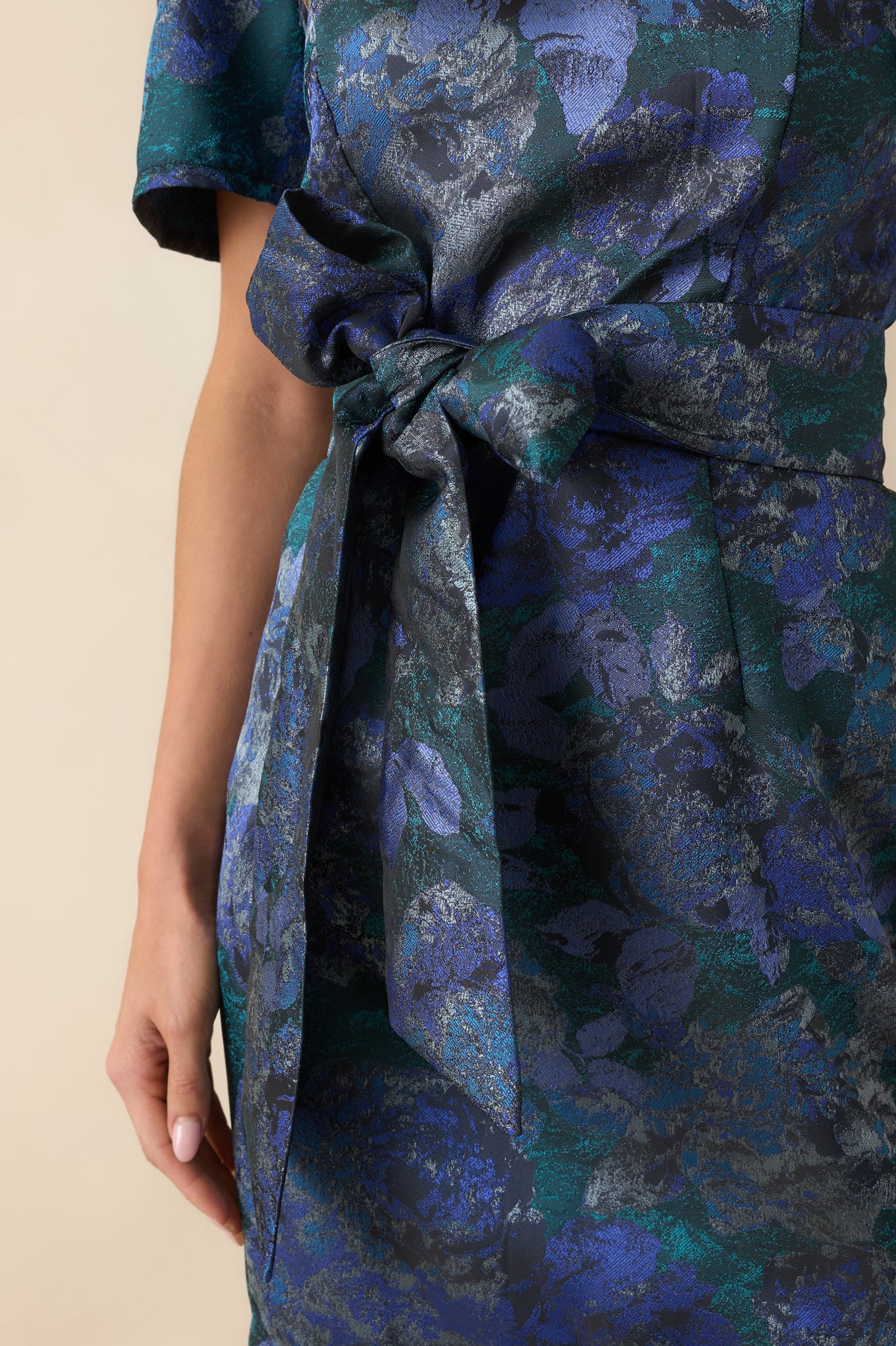 Zoomed-in view of the multicolor floral jacquard fabric with subtle metallic highlights and woven texture.