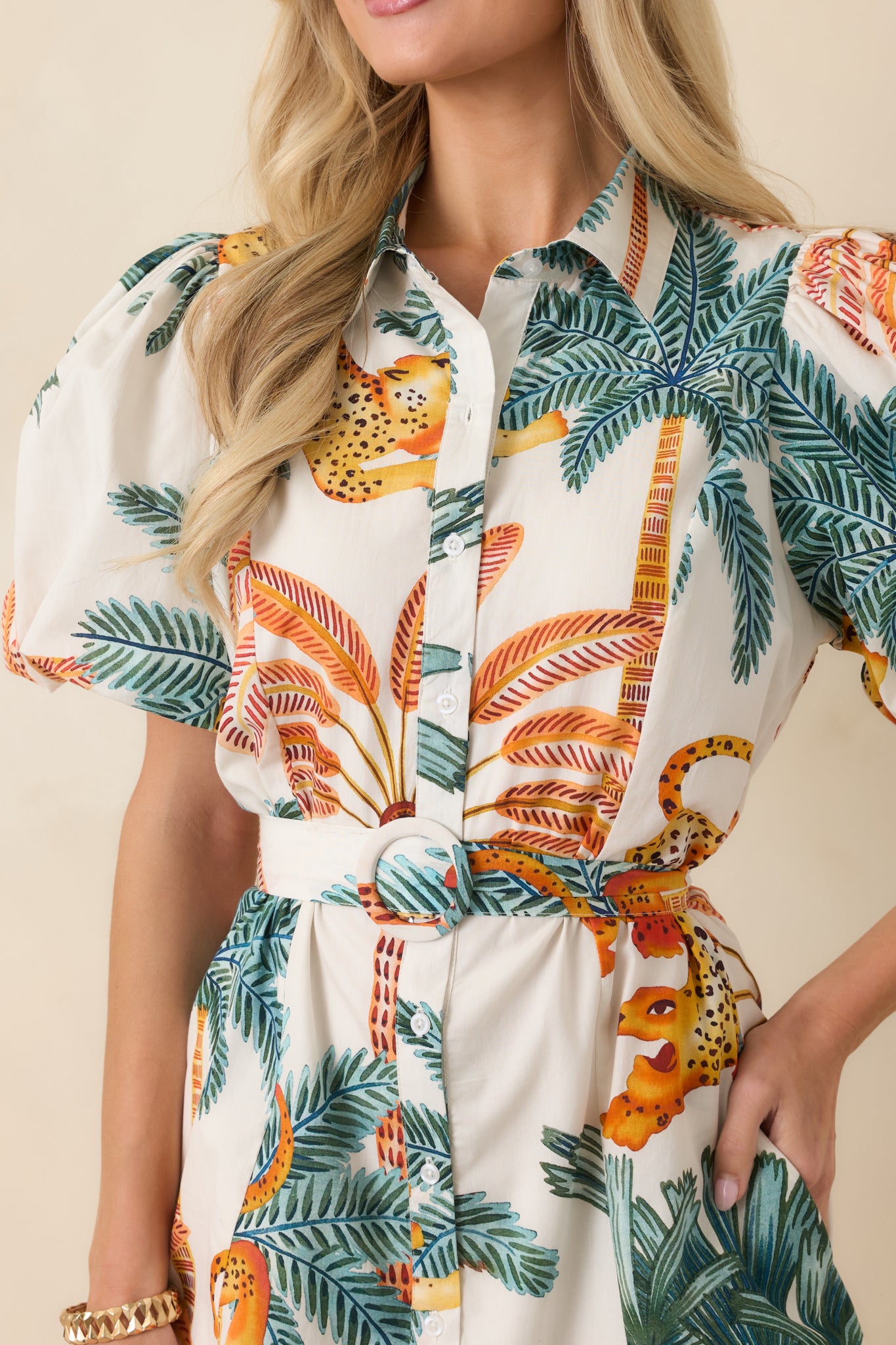 Close-up of button-front closure with tie waist and breathable cotton texture.