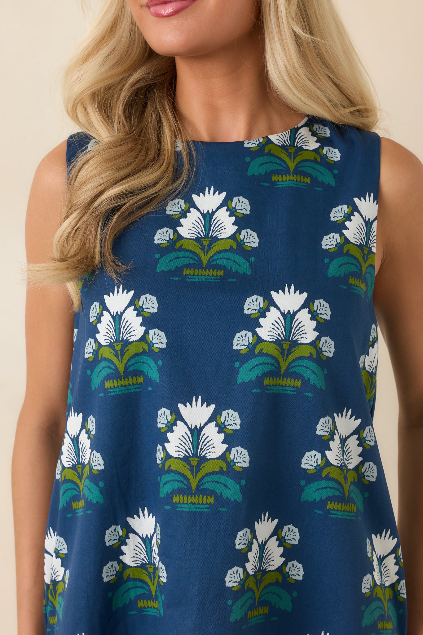 Close-up view of the floral print, cotton texture, and colorful green and teal accents.