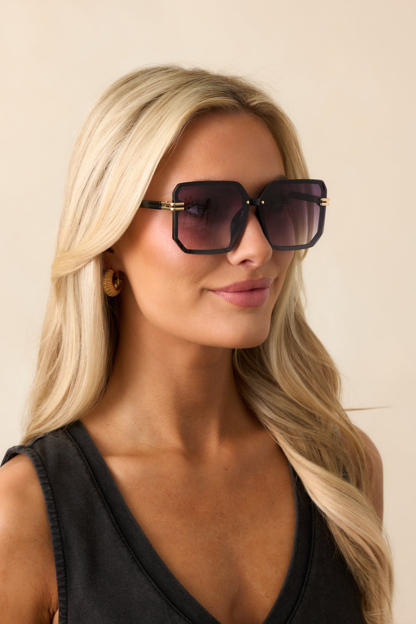 A close-up of the slim nose piece and the square purple frames, showing the gold accents on the sides for added style.