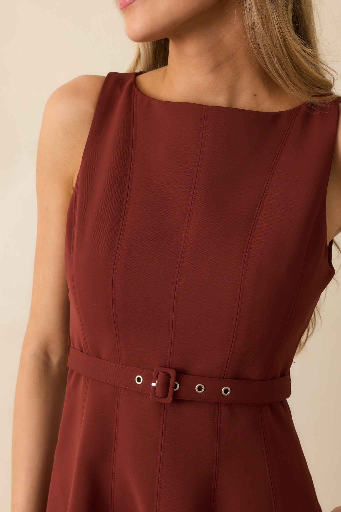 Close-up showing seamed bodice, adjustable matching belt, and fabric texture of the wine red midi dress.
