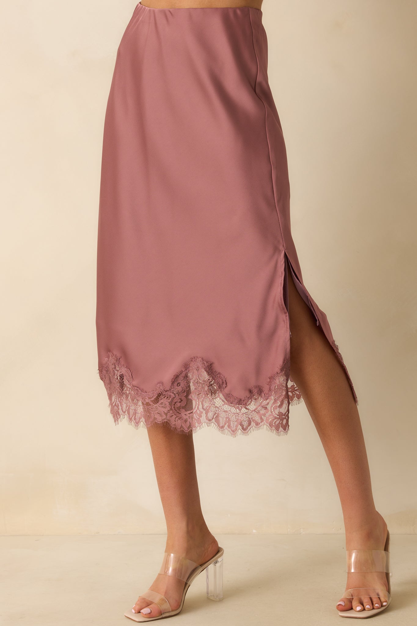 Cropped image highlighting the straight silhouette and subtle sheen of the rose pink satin.