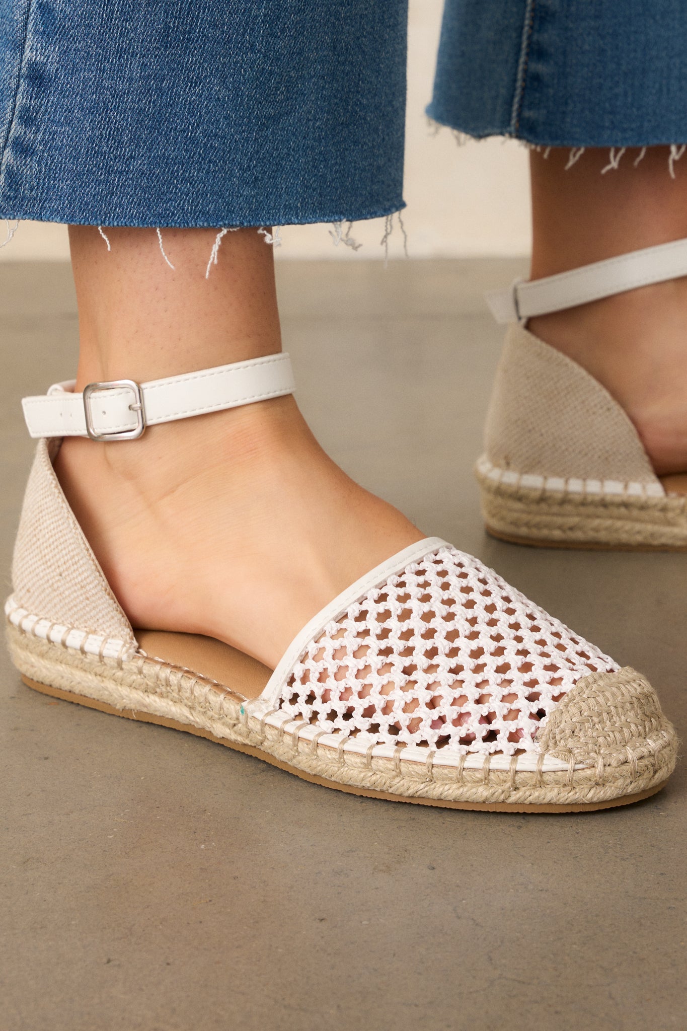 A close-up of the woven fabric of the flats, emphasizing the open texture and breathable design.