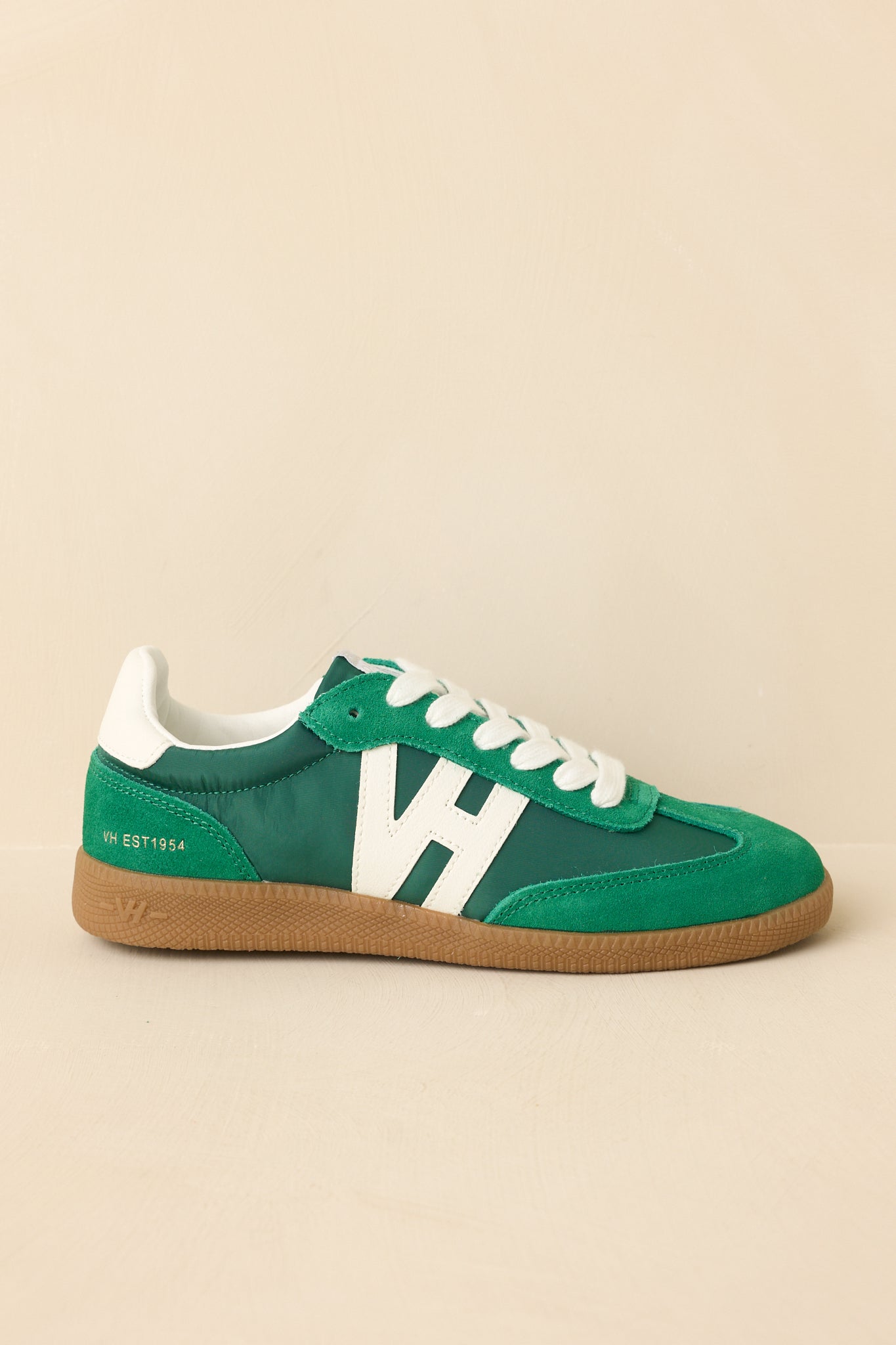 Cropped-in close view focusing on the lace area and layered materials surrounding the eyelets.