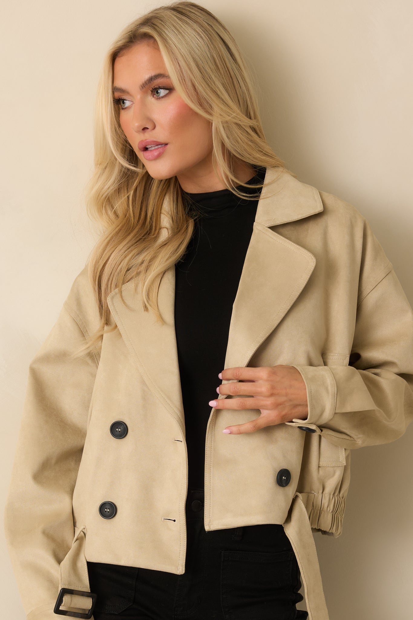 Close view highlighting the double-breasted buttons and subtle cotton texture.