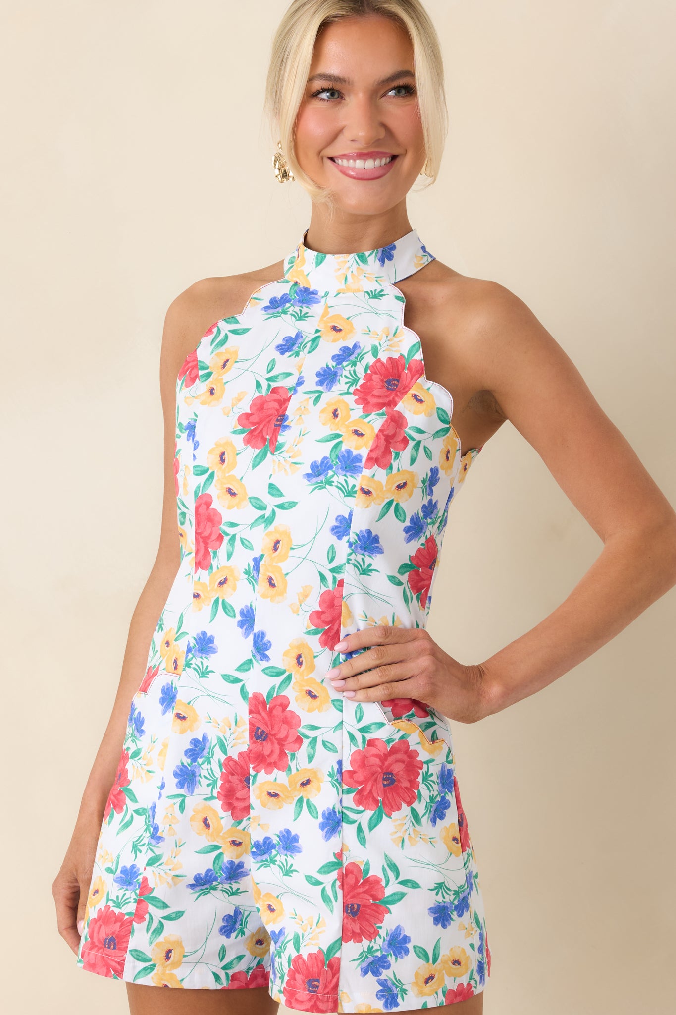 Close view of halter neckline with colorful floral pattern.