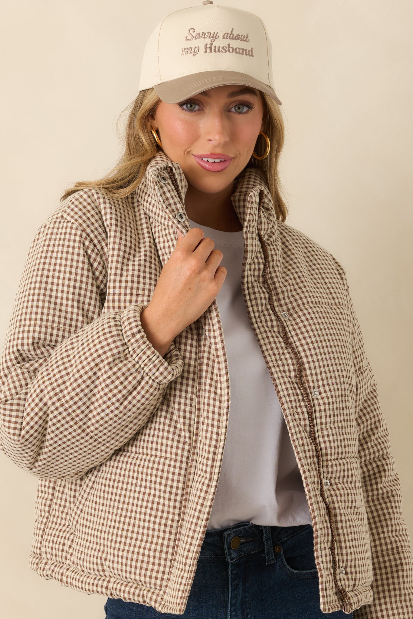 Close framing on the long sleeves and elastic cuff design with visible quilted stitching.