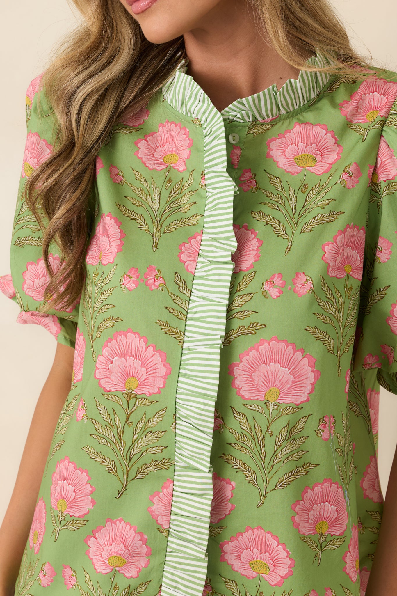 Close view of striped placket and band collar on lightweight cotton top.