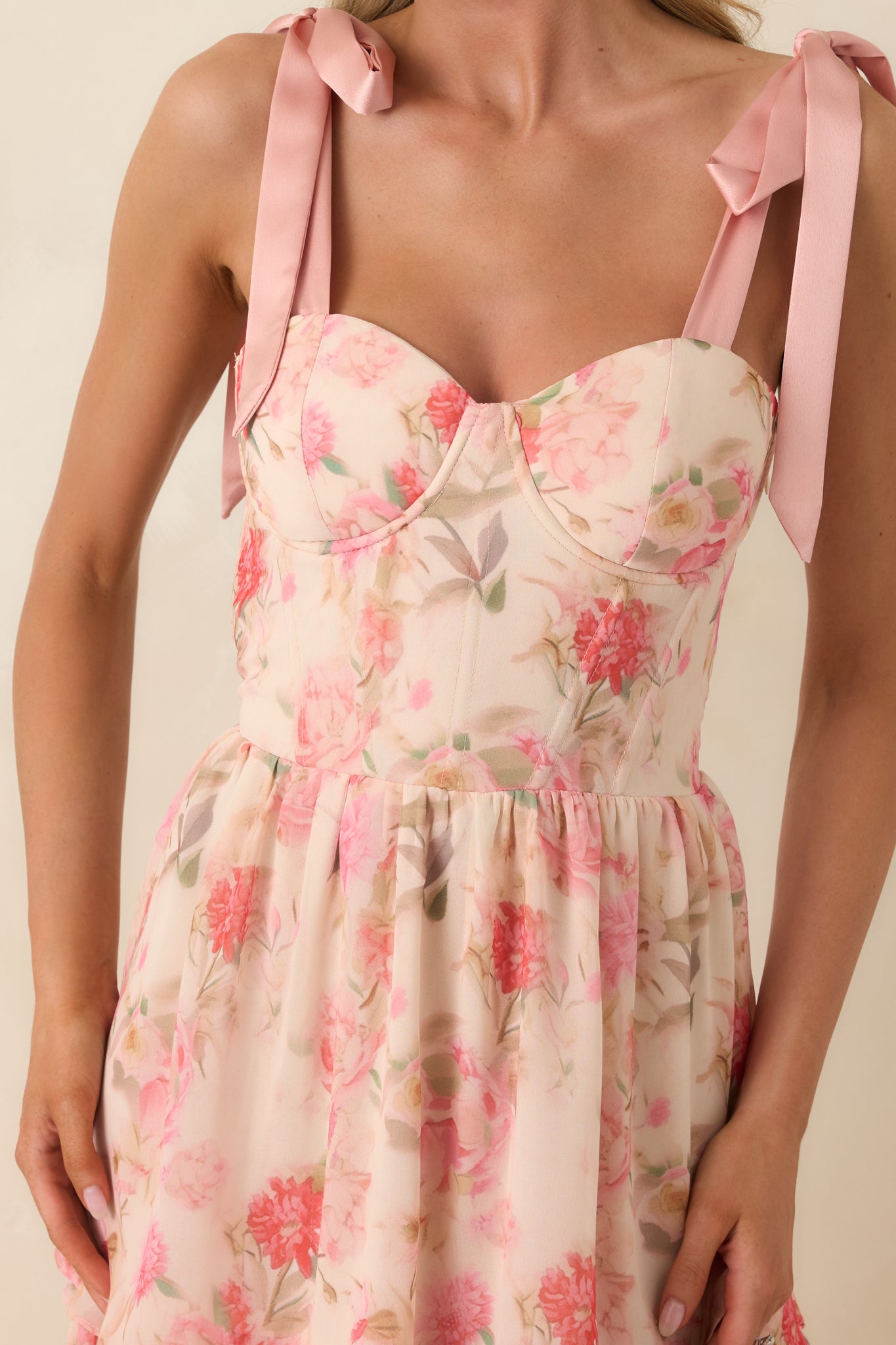 Close view of structured bust cups with a sweetheart neckline and delicate chiffon fabric texture.