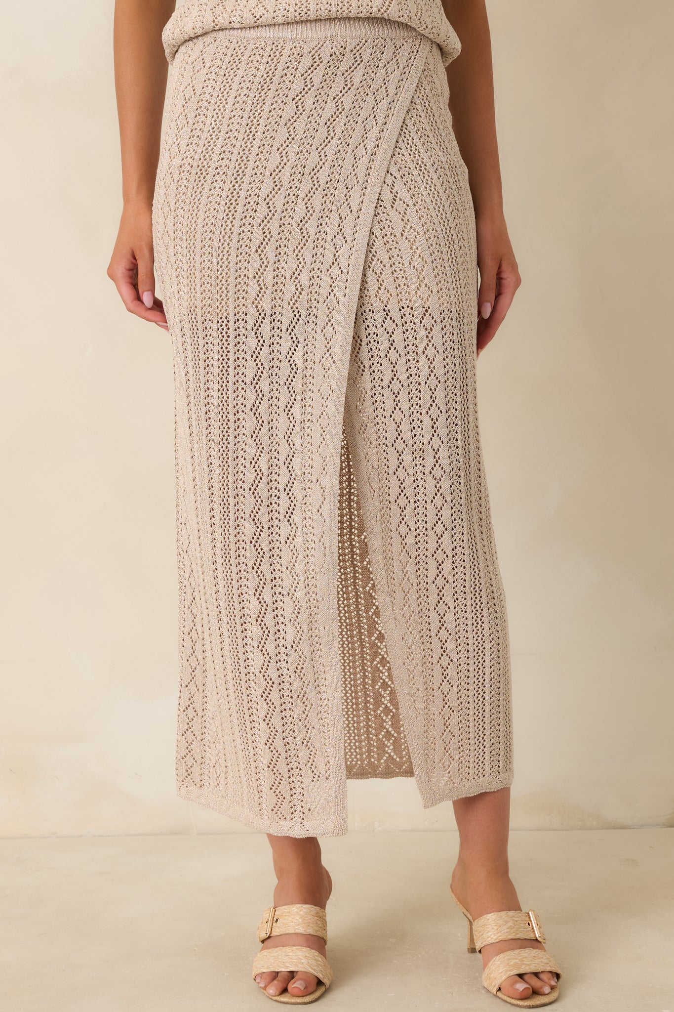 Close view of the gold pointelle knit pattern with subtle metallic shimmer.