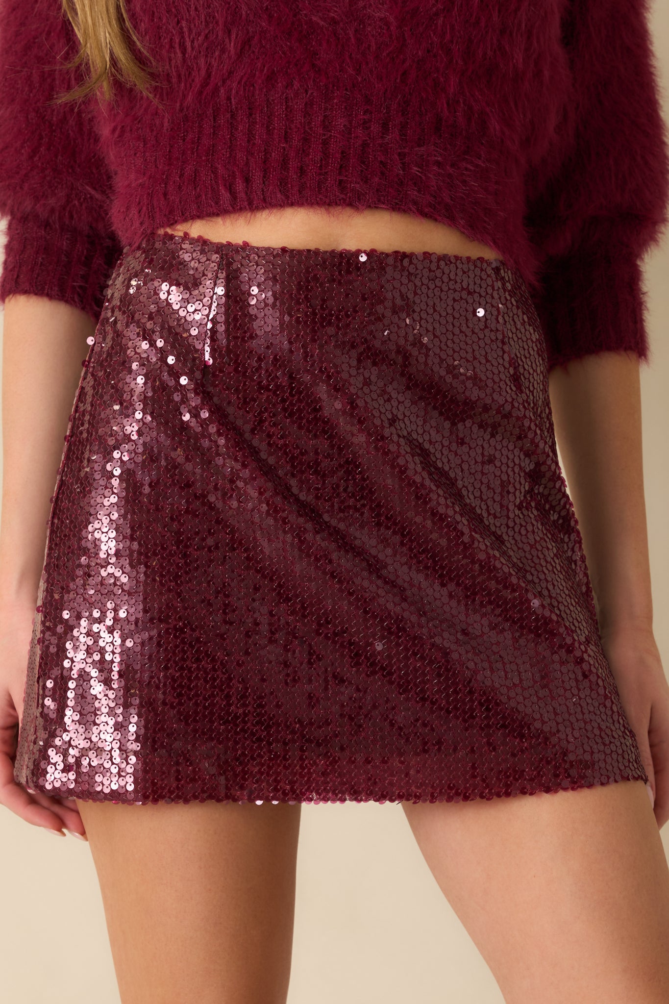 A close view reveals the rich wine purple sequins, smooth lining, and precise sequin placement.