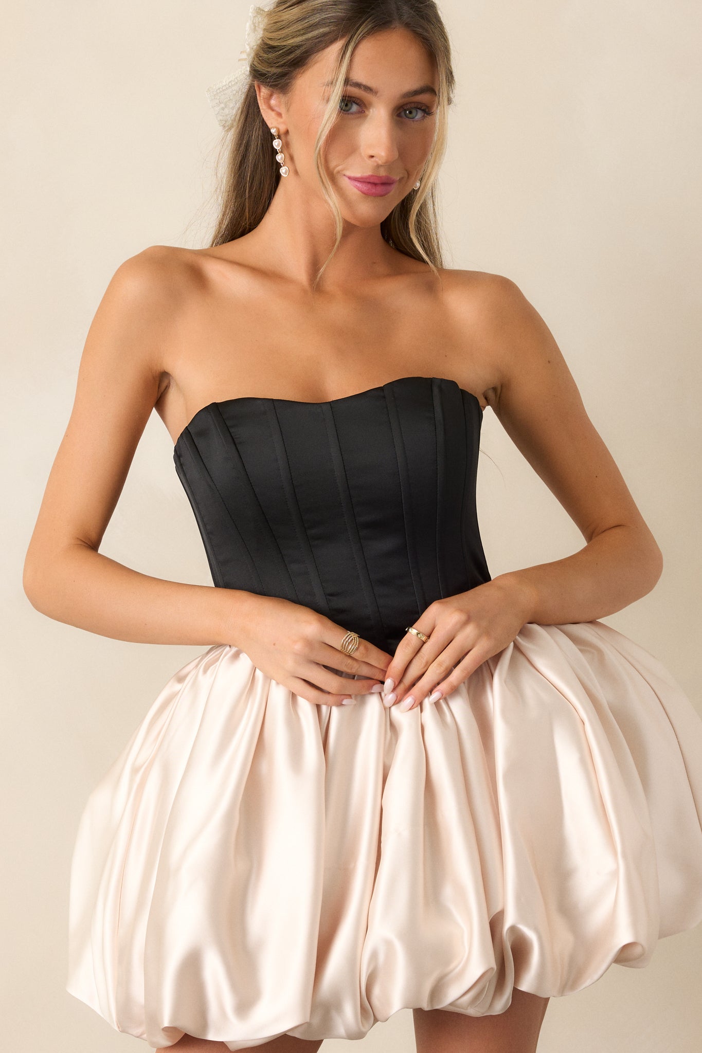 Another closer look highlighting the volume of the ivory bubble skirt and smooth fabric texture.