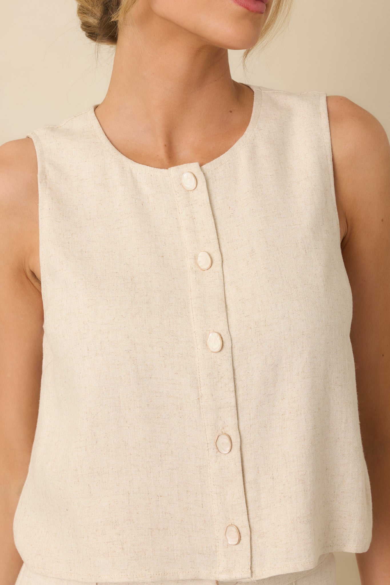 Closer view highlighting the full front button closure and relaxed fit.