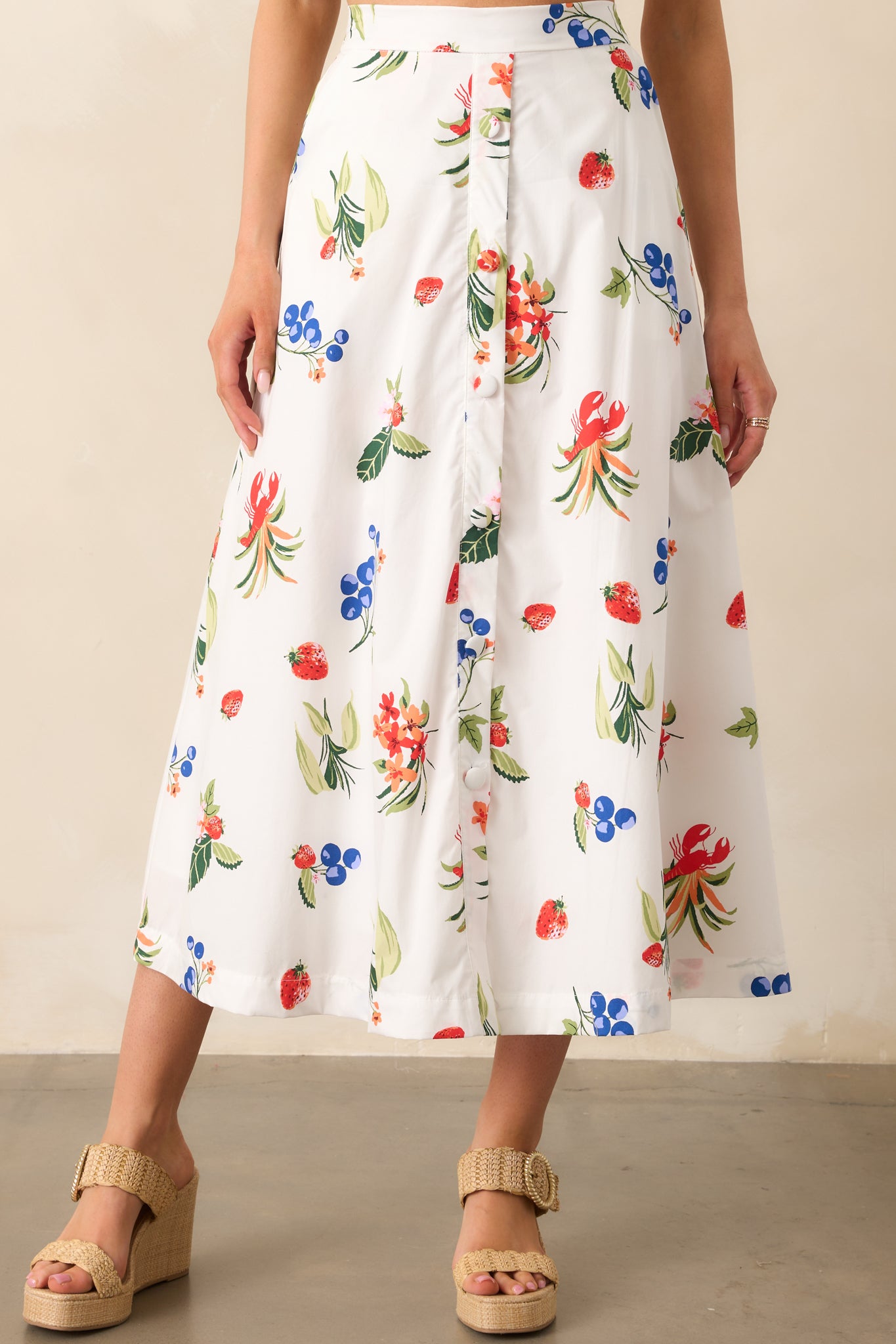  A closer view of the white skirt’s front details, showing off the button accents and pocket design.