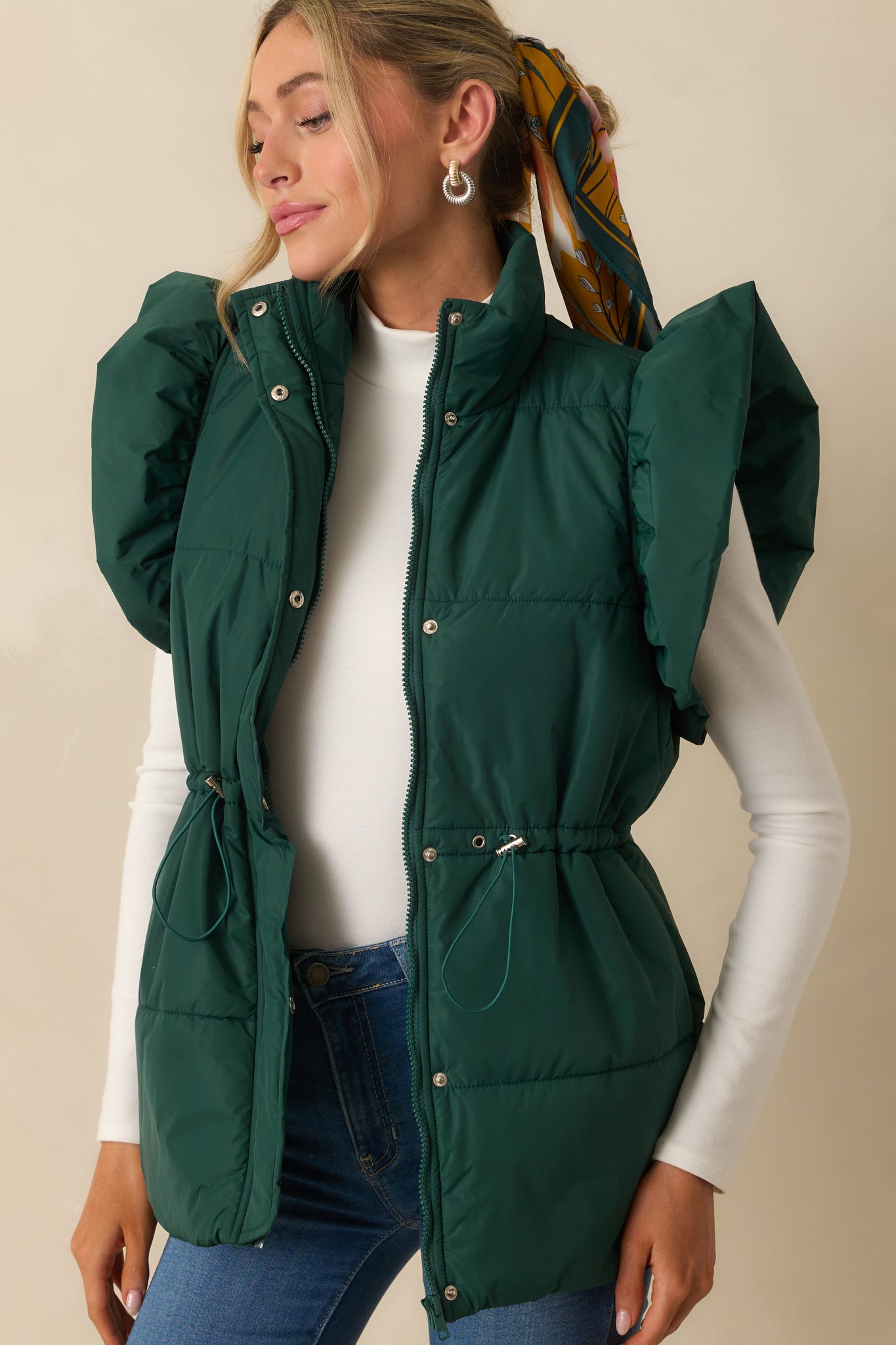 Close view of the vest’s puffer line detailing and smooth finish.