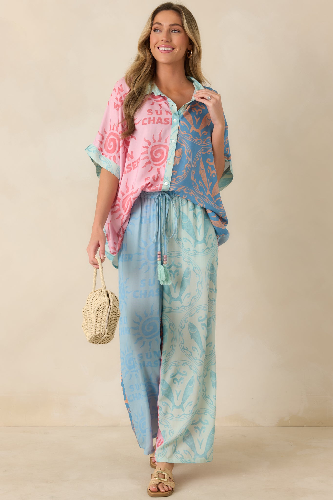 Coastal-inspired viscose top showcasing a relaxed silhouette, vibrant colorblock layout, and structured button-front detail.