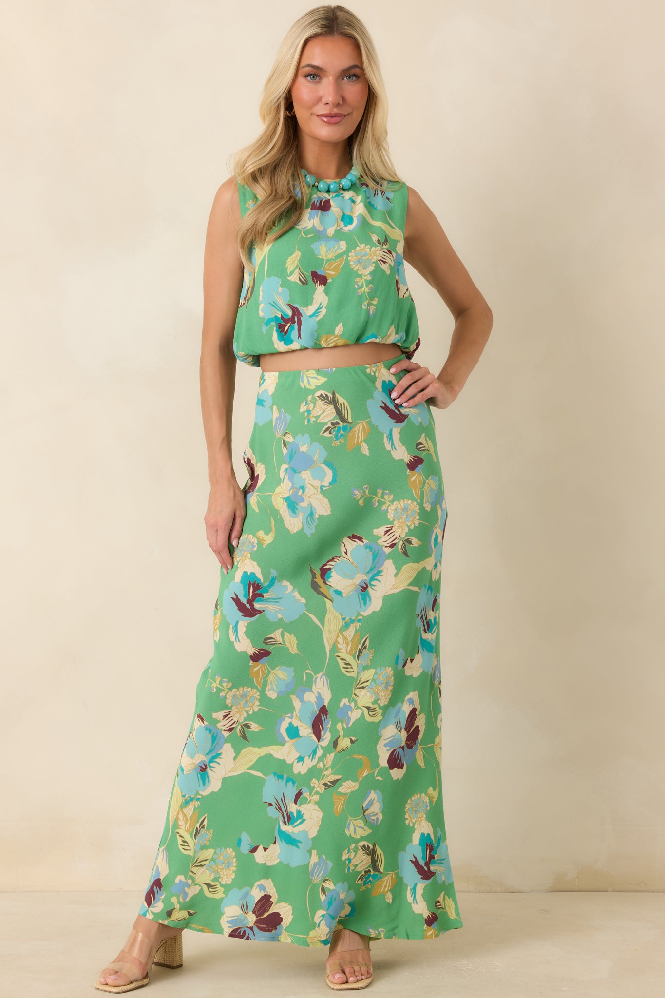 Coastal-inspired floral top showcasing vibrant green tones, a classic neckline, and an easy silhouette.
