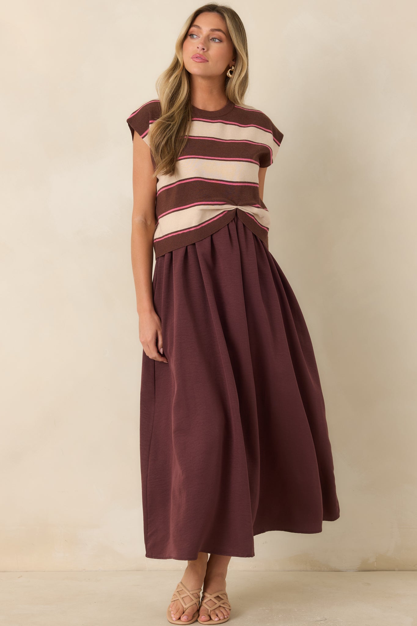 Cocoa maxi dress featuring hidden spaghetti straps beneath a sweater overlay and graceful movement throughout the skirt.