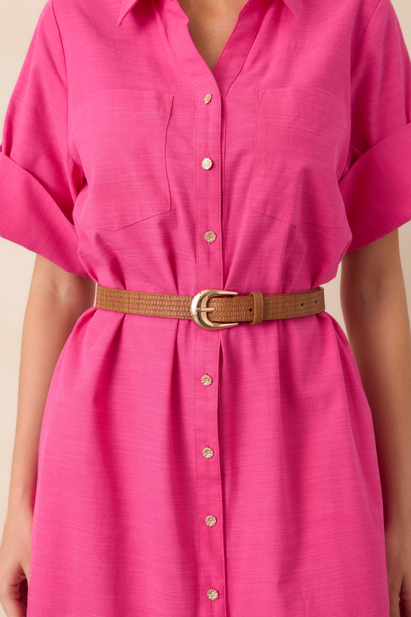 Cognac brown woven-texture faux leather belt with a gold-tone buckle.