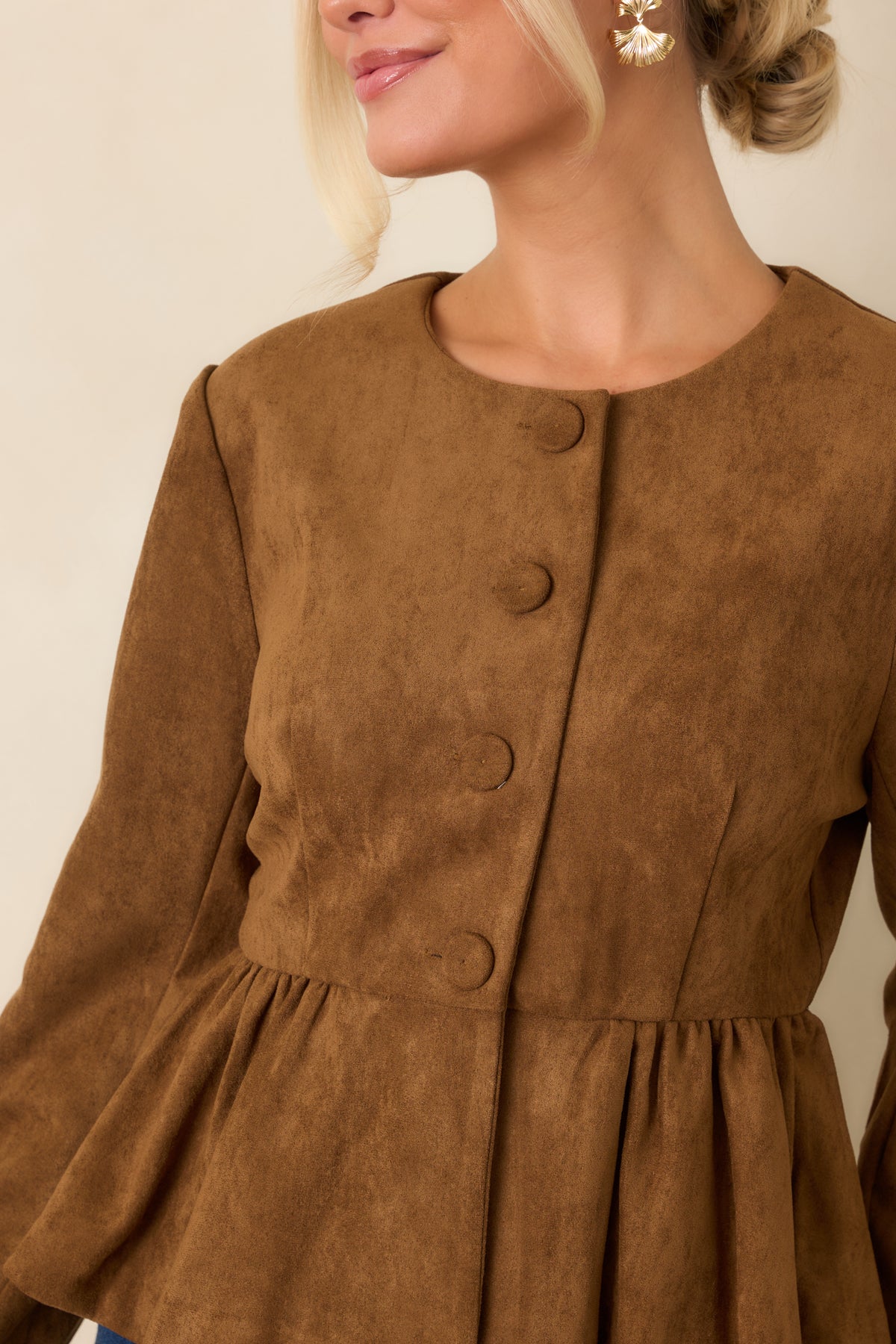 Close-up of the faux suede texture, front buttons, and subtle shoulder gathers.