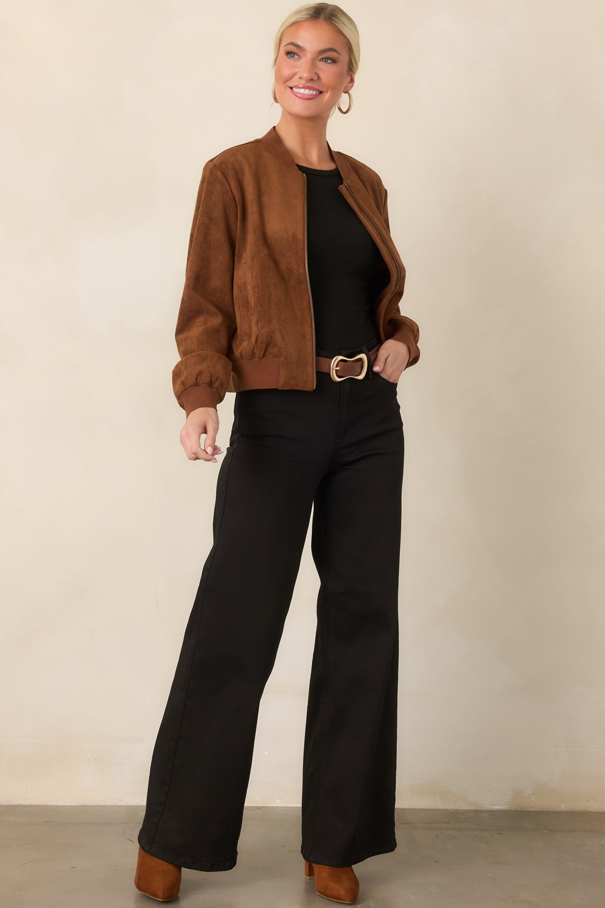 Cognac faux suede jacket showcasing its clean zip-front design and softly structured relaxed silhouette.