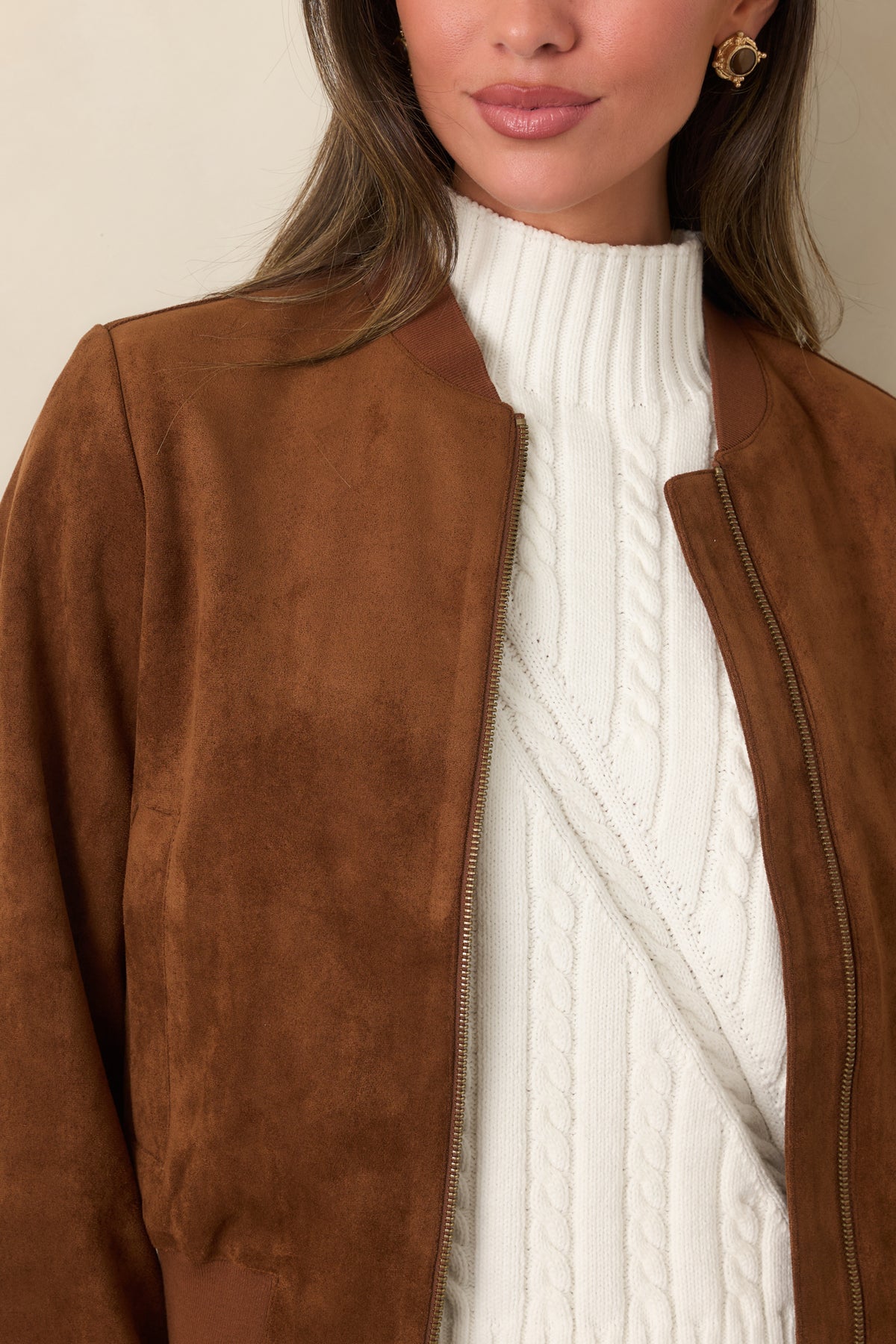 Cognac faux suede jacket features a classic zip front and practical side welt pockets beneath its ribbed baseball collar.