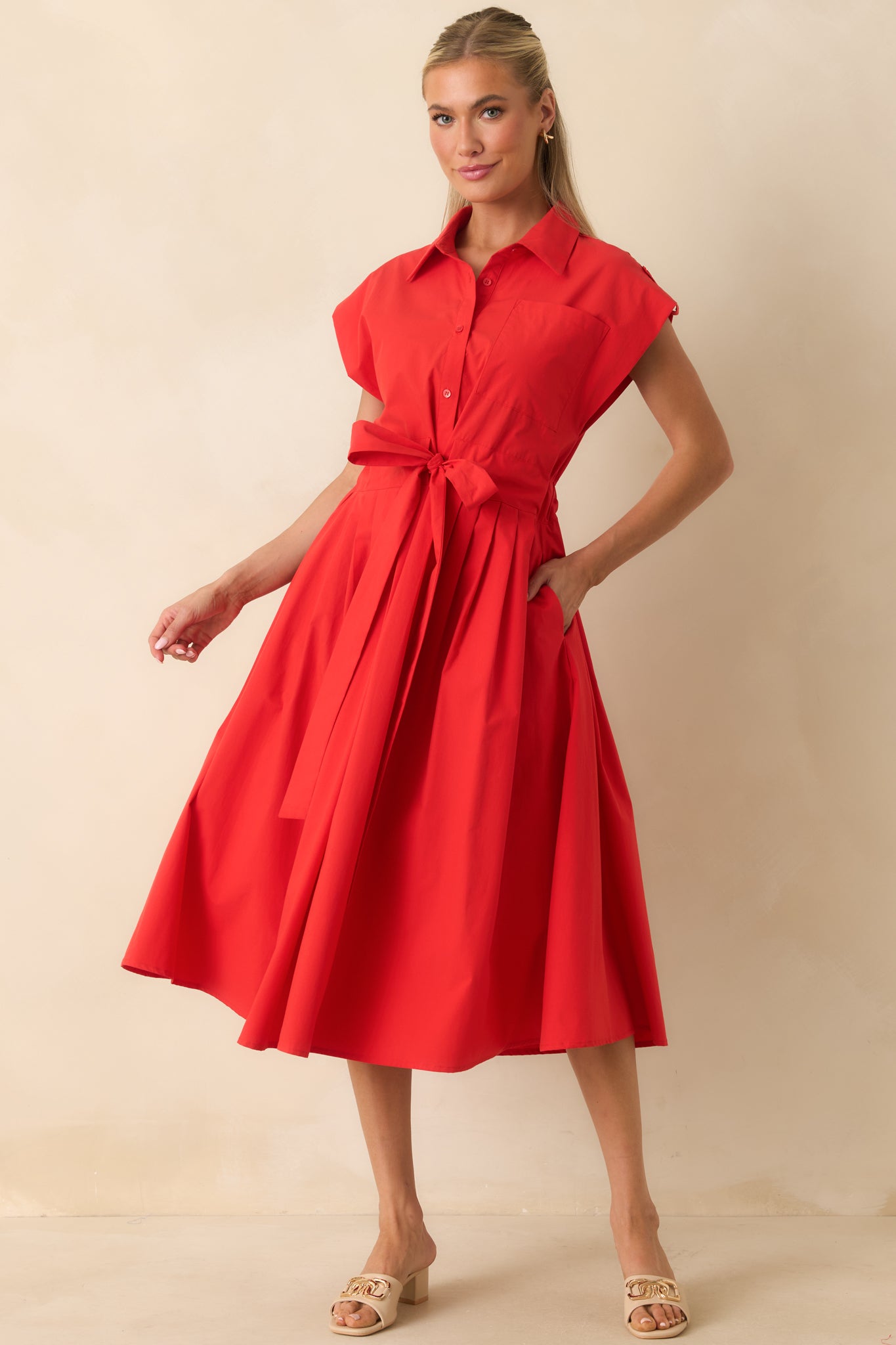 Collared midi dress designed with a flattering self-tie belt, pleated skirt detail, and versatile pocket accents.