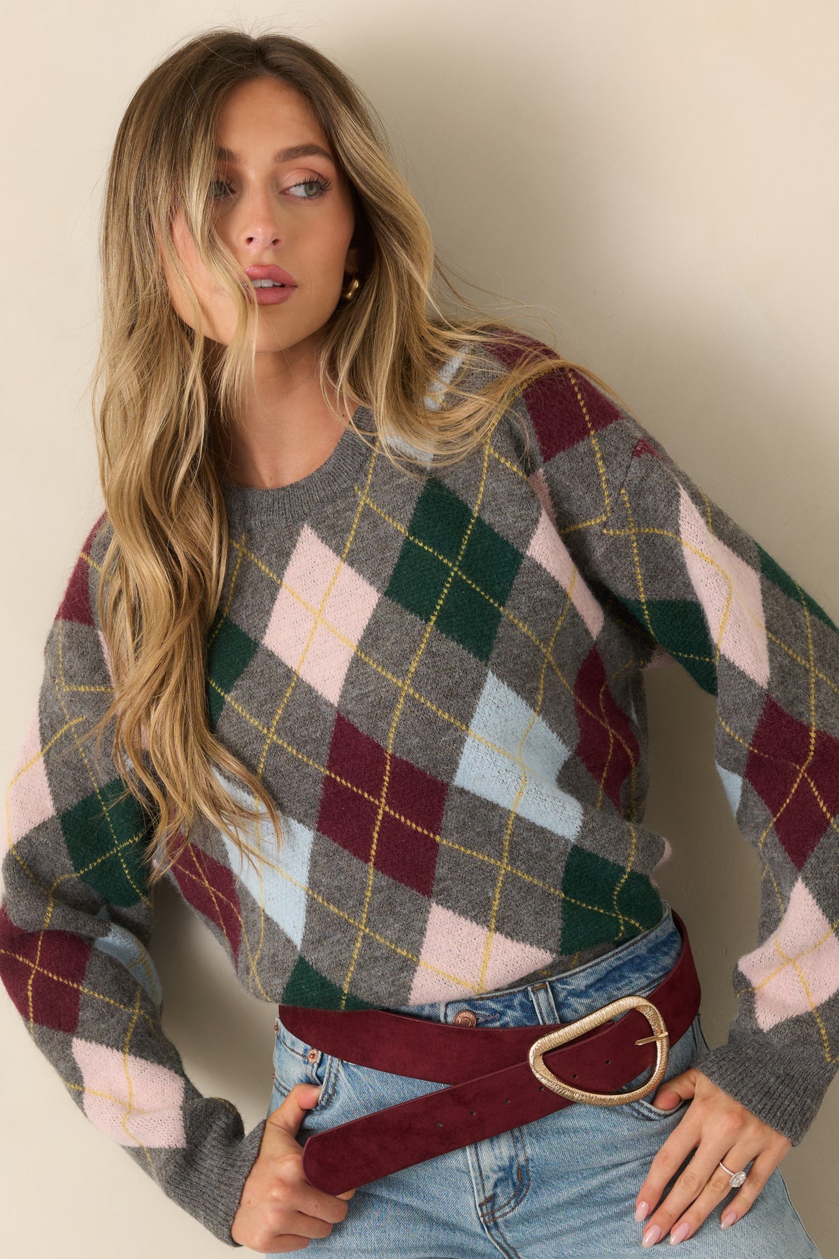 Colorful argyle knit design combining burgundy, forest green, blush pink, light blue, and golden yellow accents.